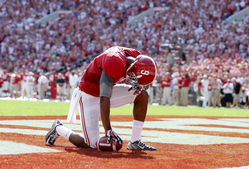 Sep 20, 2014; Tuscaloosa, AL, USA; Alabama Crimson Tide wide receiver Amari Cooper (9) takes a moment after caching a pass for a touchdown against the Florida Gators at Bryant-Denny Stadium. Mandatory Credit: Marvin Gentry-USA TODAY Sports