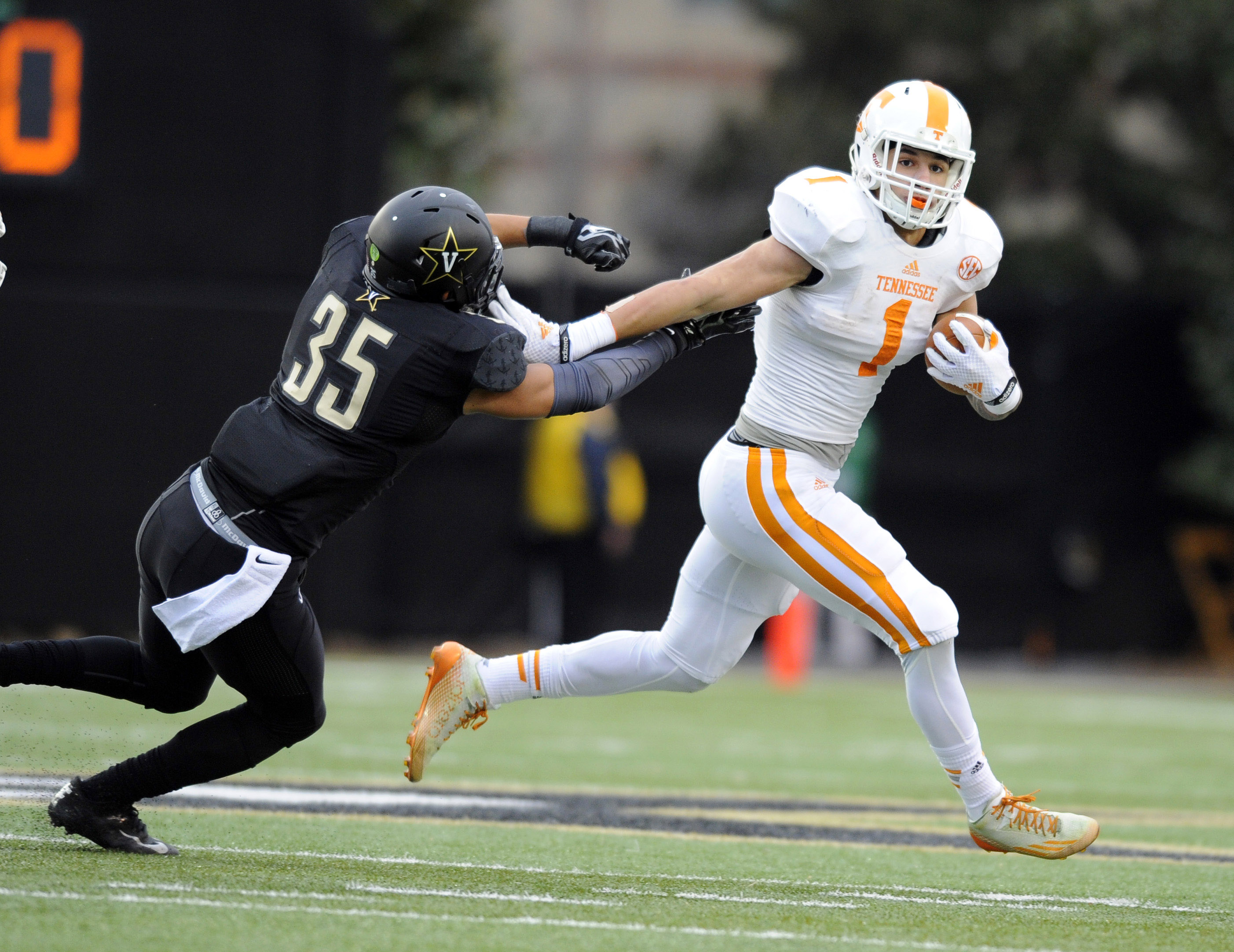 Nov 29, 2014; Nashville, TN, USA; Tennessee Volunteers running back Jalen Hurd (1) runs for a short gain during the first half against the Vanderbilt Commodores at Vanderbilt Stadium. Mandatory Credit: Christopher Hanewinckel-USA TODAY Sports