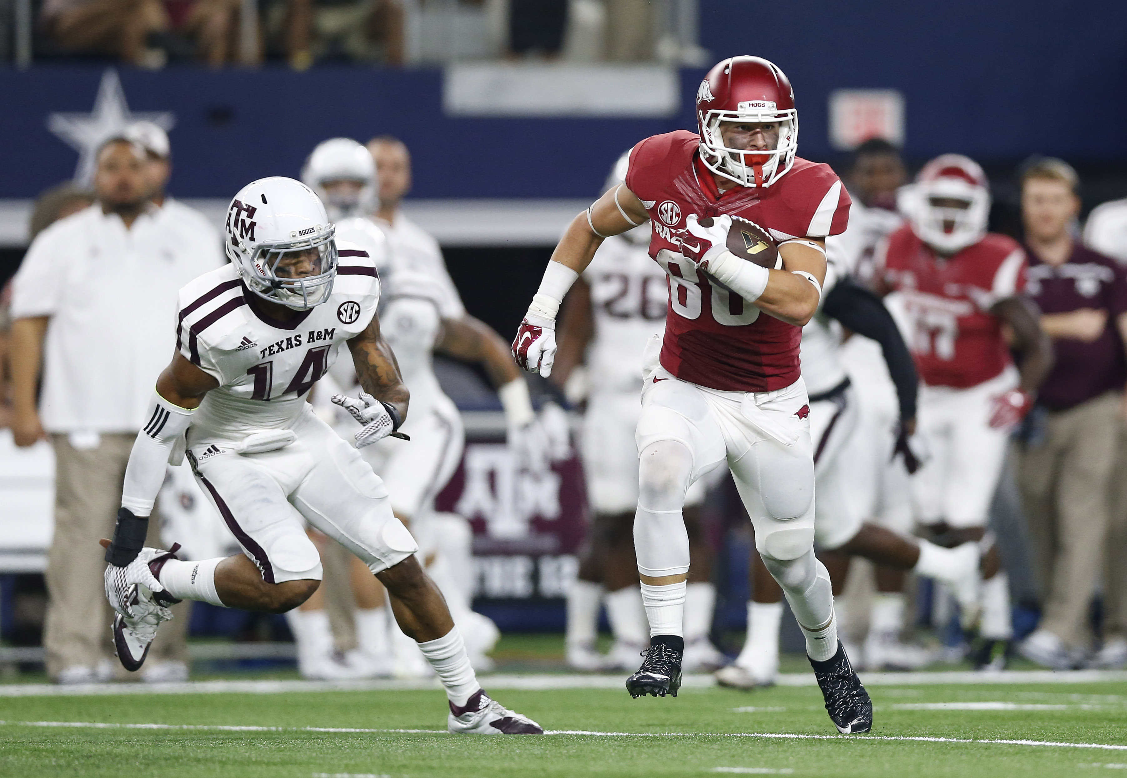 Sep 26, 2015; Arlington, TX, USA; Arkansas Razorbacks receiver Drew Morgan (80) runs after a reception against Texas A&M Aggies safety Justin Evans (14) at AT&T Stadium. Mandatory Credit: Matthew Emmons-USA TODAY Sports