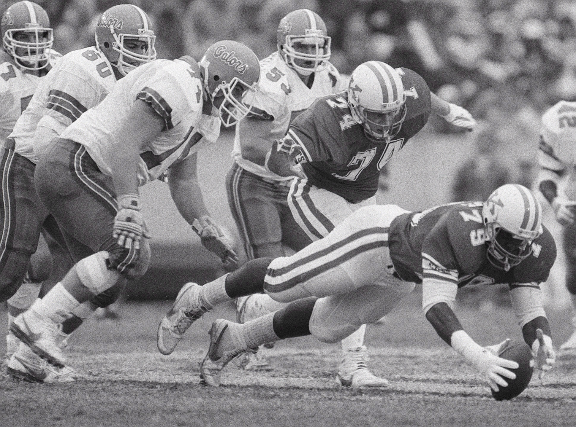 1986 FILE PHOTO. The University of Kentucky defensive lineman Oliver Barnett dove for a loose ball during UK's 10-3 victory over the University of Florida on November 15, 1986 at Commonwealth Stadium in Lexington, KY.