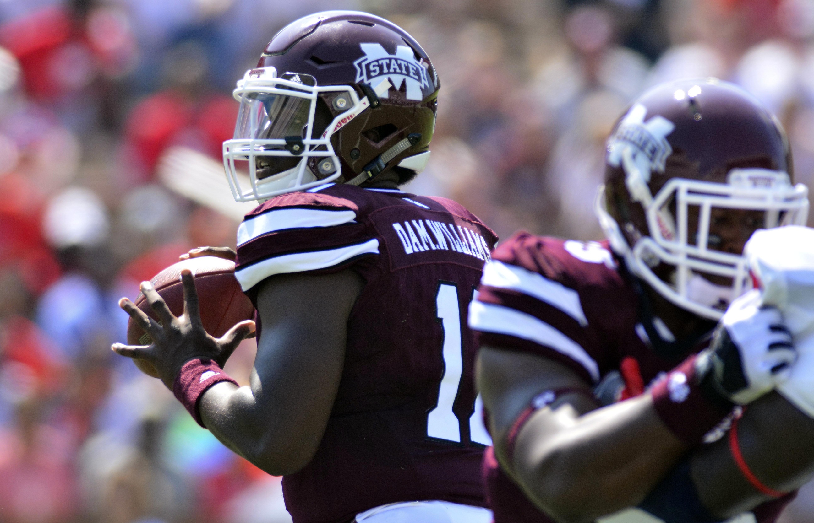 Sep 3, 2016; Starkville, MS, USA; Mississippi State Bulldogs quarterback Damian Williams (11) drops back to pass during the first quarter of the game against the South Alabama Jaguars at Davis Wade Stadium. Mandatory Credit: Matt Bush-USA TODAY Sports