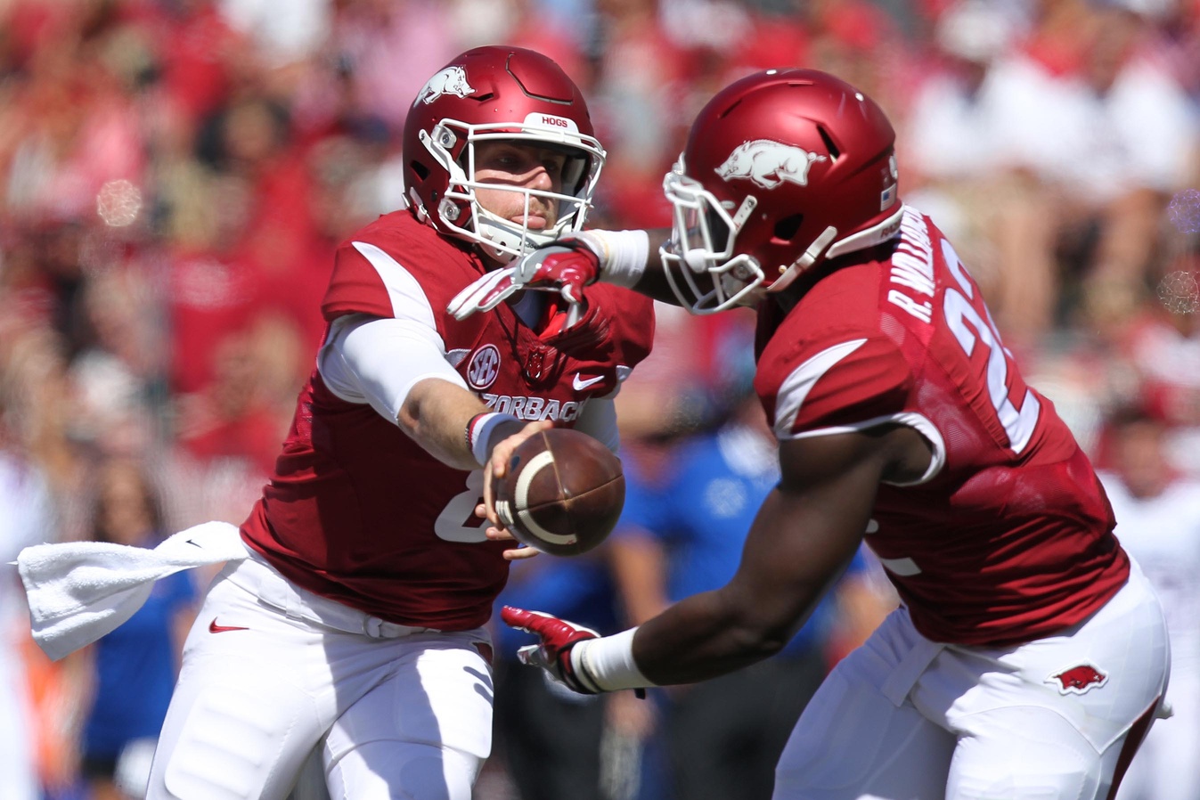 Sep 3, 2016; Fayetteville, AR, USA; Arkansas Razorbacks quarter back Austin Allen (8) hands the ball off to running back Rawleigh Williams III (22) during the first half against the Louisiana Tech Bulldogs at Donald W. Reynolds Razorback Stadium. Mandatory Credit: Nelson Chenault-USA TODAY Sports