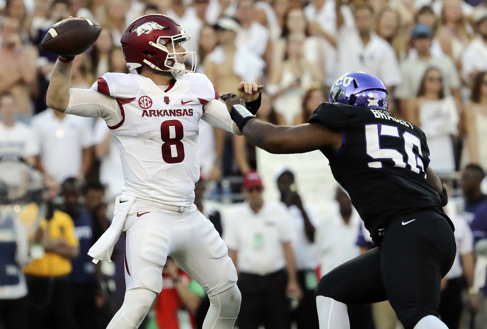 Sep 10, 2016; Fort Worth, TX, USA; Arkansas Razorbacks quarterback Austin Allen (8) throws as TCU Horned Frogs defensive tackle Chris Bradley (56) defends during the first half at Amon G. Carter Stadium. Mandatory Credit: Kevin Jairaj-USA TODAY Sports