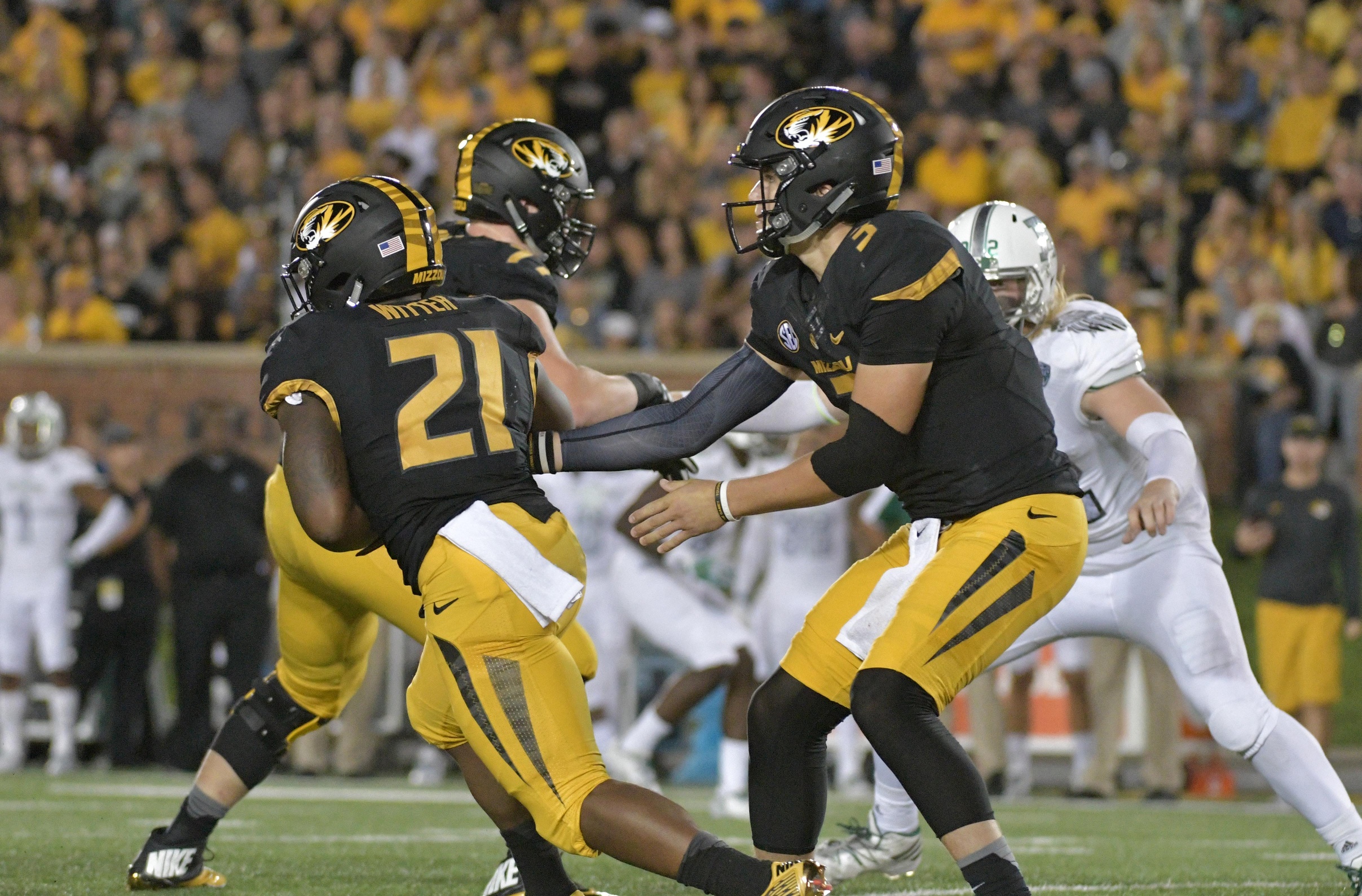 Sep 10, 2016; Columbia, MO, USA; Missouri Tigers quarterback Drew Lock (3) hands off to running back Ish Witter (21) during the first half against the Eastern Michigan Eagles at Faurot Field. Mandatory Credit: Denny Medley-USA TODAY Sports