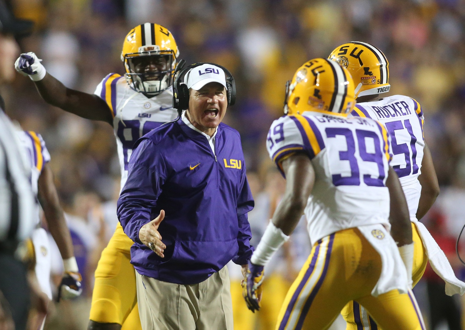 Sep 10, 2016; Baton Rouge, LA, USA; LSU Tigers head coach Les Miles congratulates Russell Gage (39) after a tackle against the Jacksonville State Gamecocks during the second half at Tiger Stadium. LSU defeated Jacksonville State 34-13. Mandatory Credit: Crystal LoGiudice-USA TODAY Sports