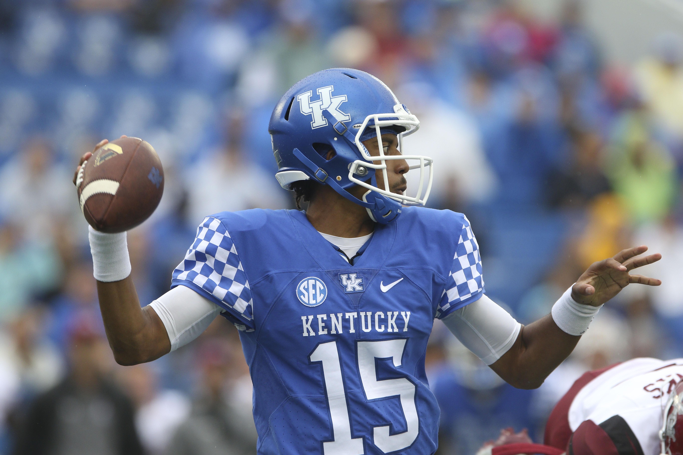 Sep 17, 2016; Lexington, KY, USA; Kentucky Wildcats quarterback Stephen Johnson (15) drops back to pass the ball against the New Mexico State Aggies in the first quarter at Commonwealth Stadium. Mandatory Credit: Mark Zerof-USA TODAY Sports
