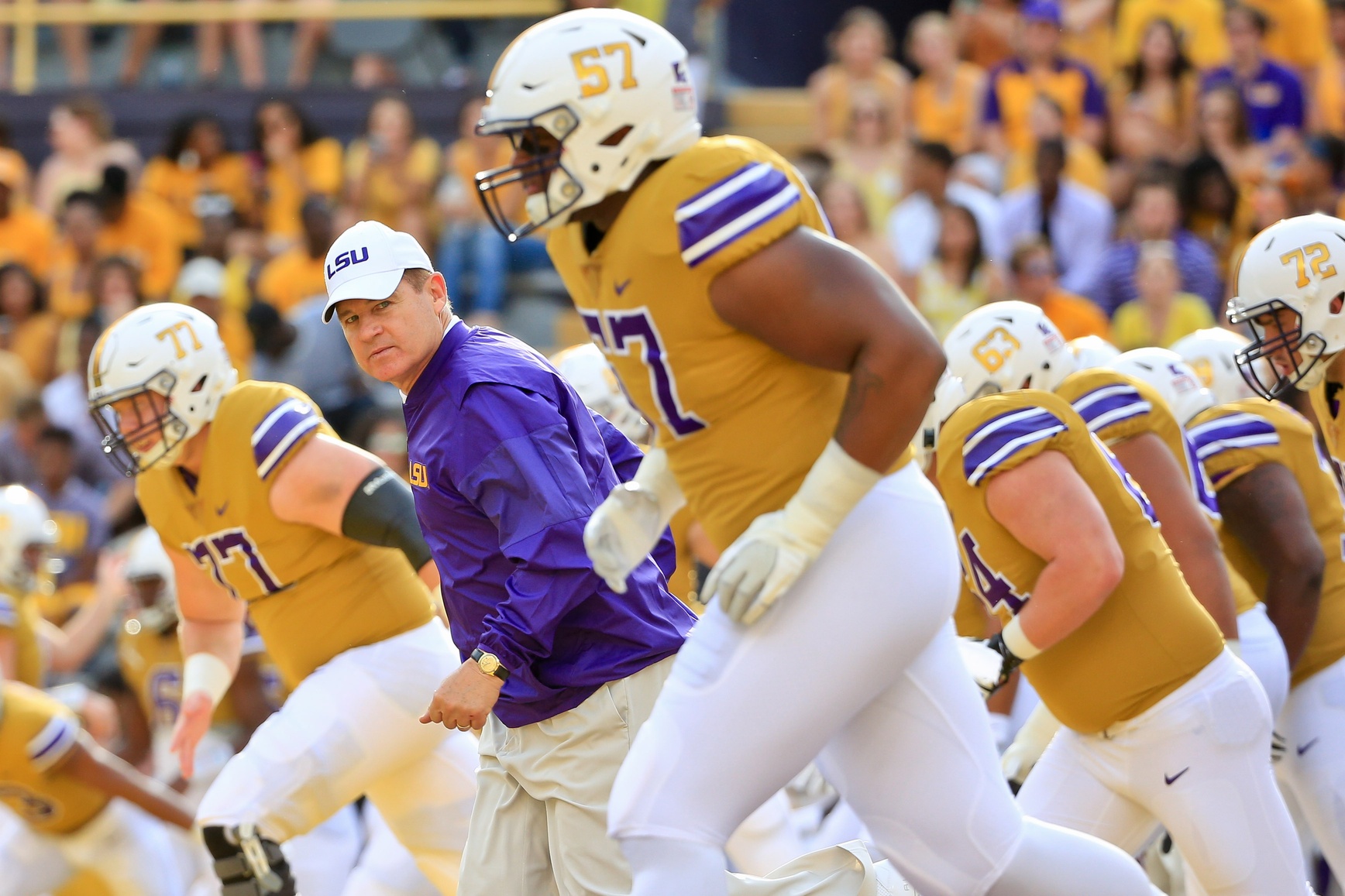 Sep 17, 2016; Baton Rouge, LA, USA; LSU Tigers head coach Les Miles runs onto the field with his team before a game against the Mississippi State Bulldogs at Tiger Stadium. Mandatory Credit: Derick E. Hingle-USA TODAY Sports