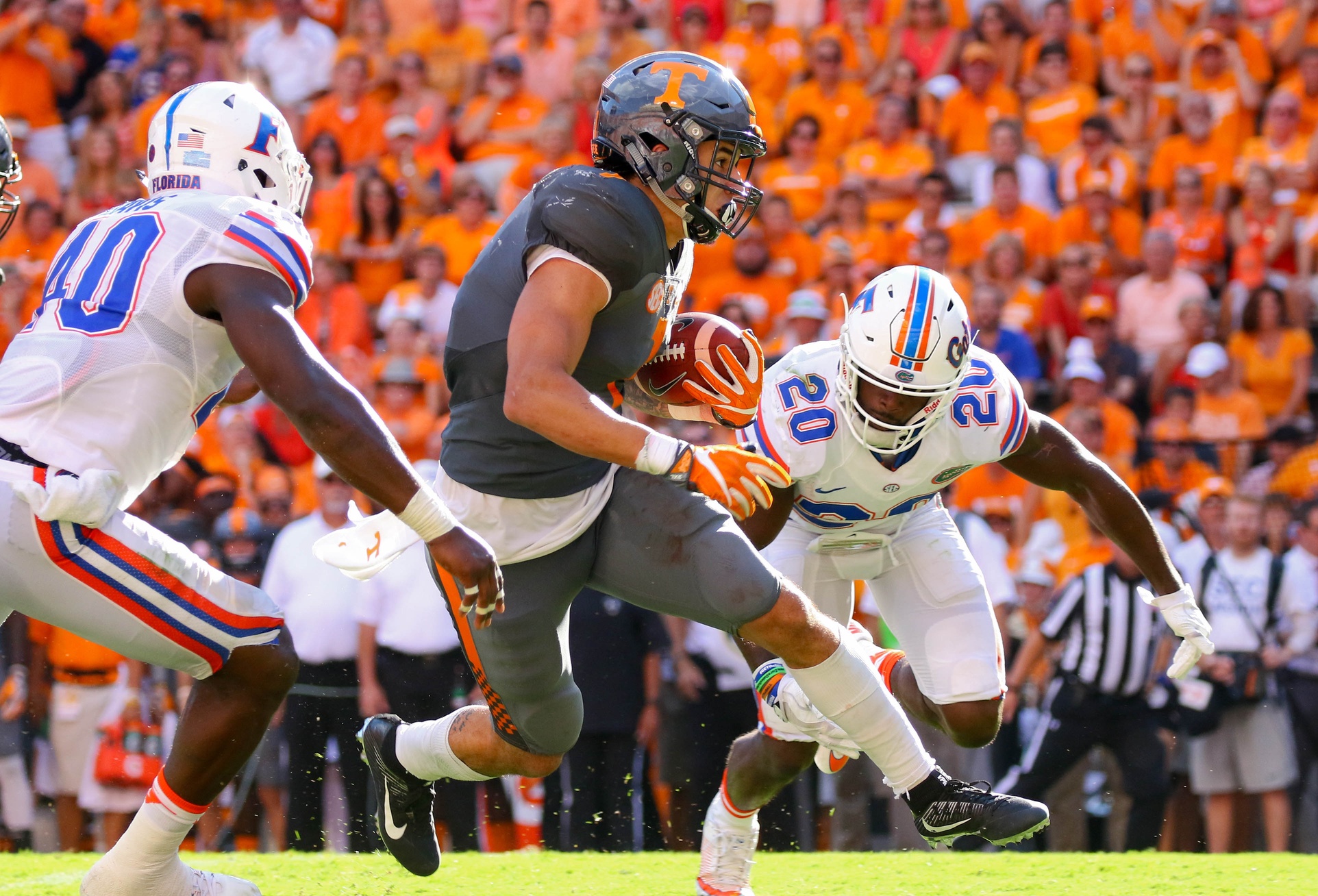 Sep 24, 2016; Knoxville, TN, USA; Tennessee Volunteers running back Jalen Hurd (1) runs the ball against Florida Gators defensive back Marcus Maye (20) during the second quarter at Neyland Stadium. Mandatory Credit: Randy Sartin-USA TODAY Sports