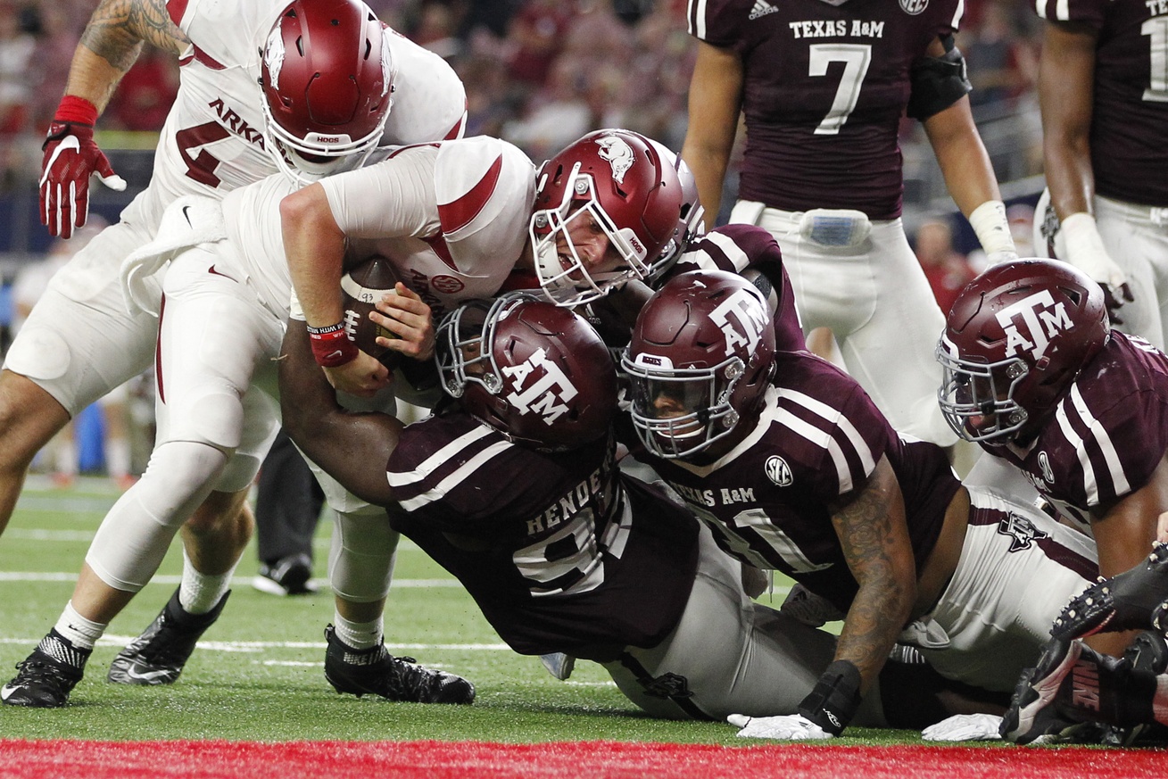 Sep 24, 2016; Dallas, TX, USA; Arkansas Razorbacks quarterback Austin Allen (8) is gang tackled at the one yard line in the third quarter by the Texas A&M Aggies defense at AT&T Stadium. Mandatory Credit: Tim Heitman-USA TODAY Sports