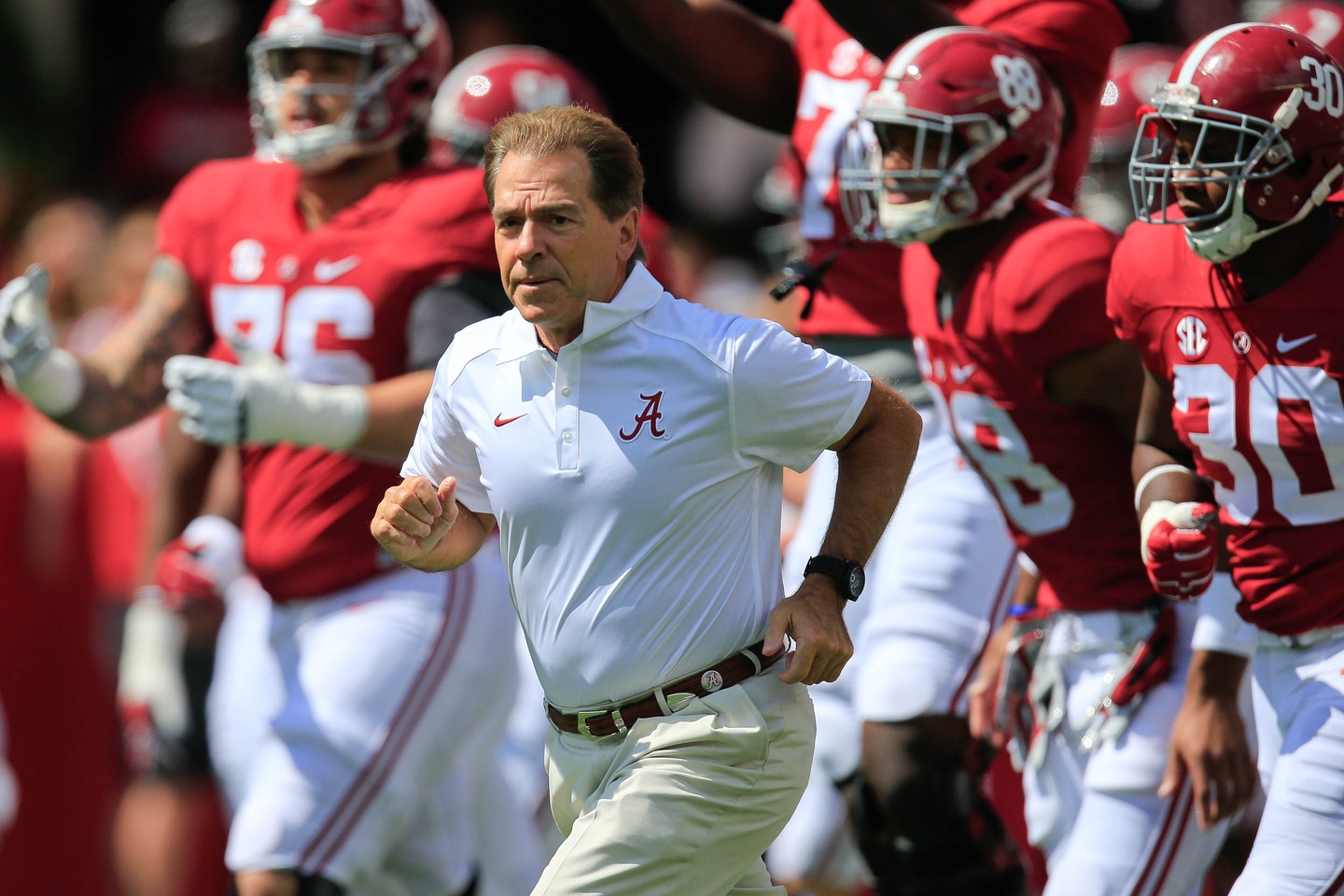 Sep 12, 2015; Tuscaloosa, AL, USA; Alabama Crimson Tide head coach Nick Saban brings his team onto the field prior to the game against Middle Tennessee Blue Raiders at Bryant-Denny Stadium. Mandatory Credit: Marvin Gentry-USA TODAY Sports