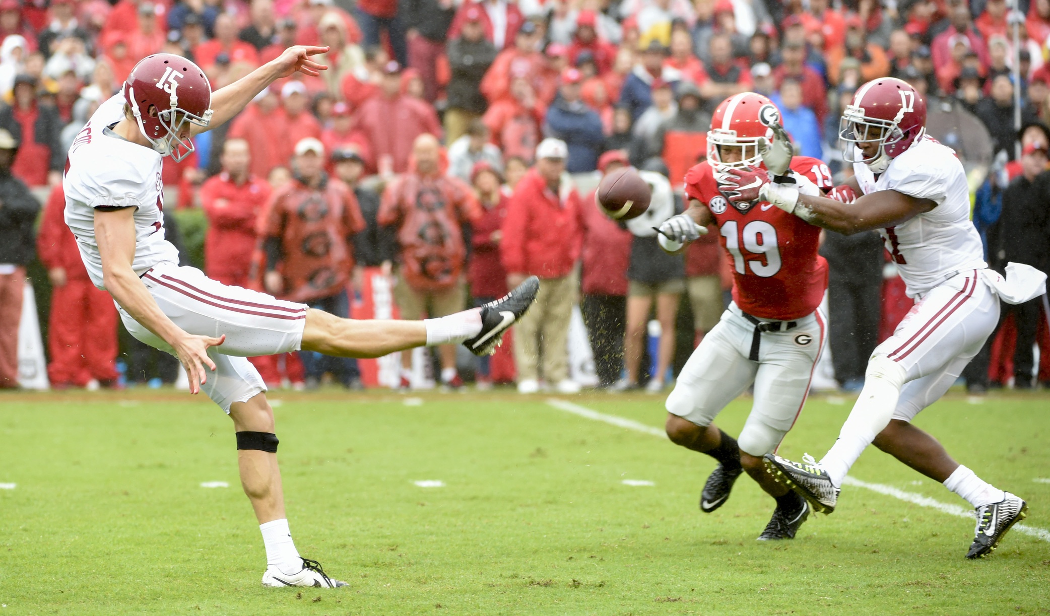 Oct 3, 2015; Athens, GA, USA; Alabama Crimson Tide punter JK Scott (15) kicks the ball during the first quarter against the Georgia Bulldogs at Sanford Stadium. Mandatory Credit: John David Mercer-USA TODAY Sports