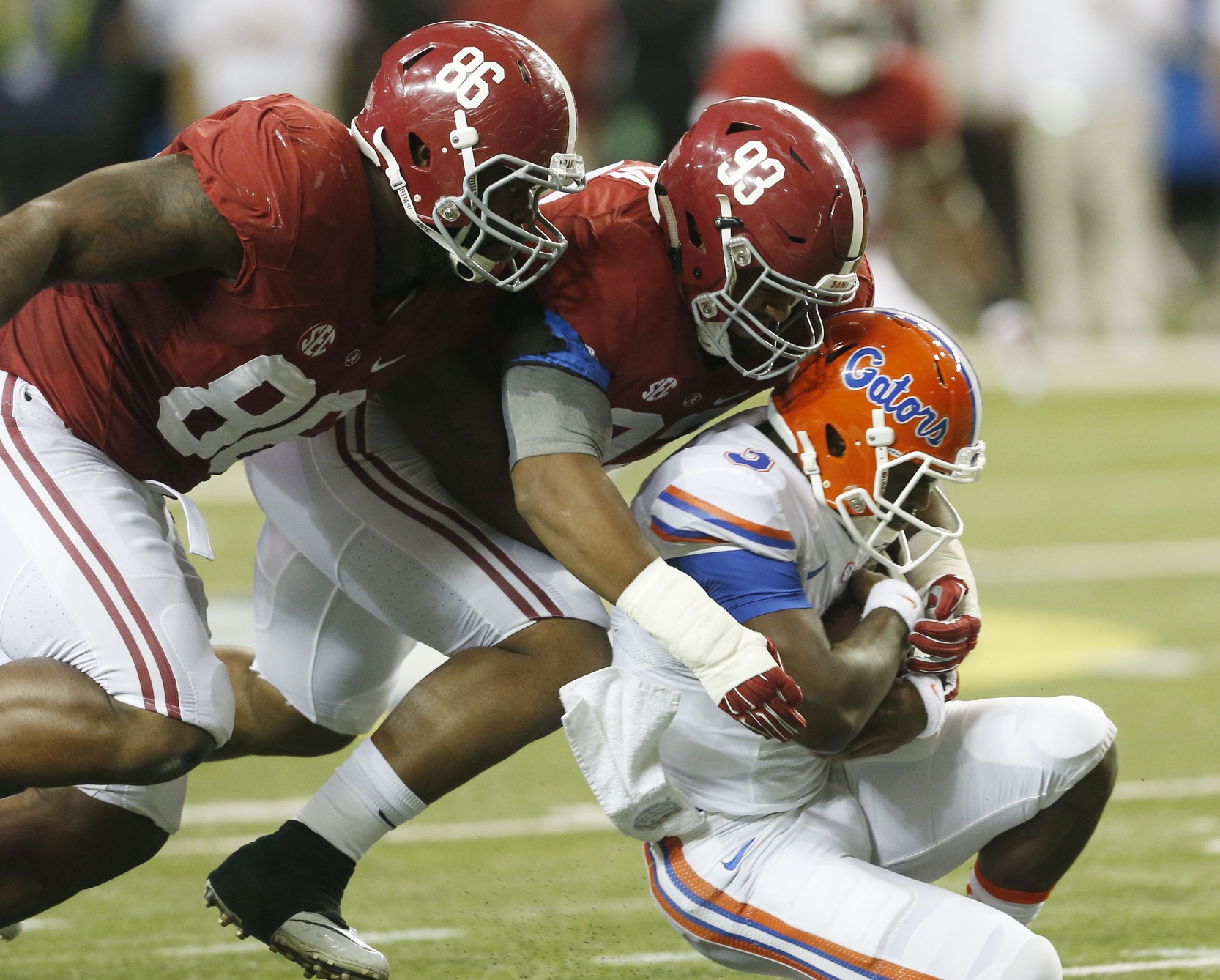 Dec 5, 2015; Atlanta, GA, USA; Alabama Crimson Tide defensive lineman Jonathan Allen (93) and A'Shawn Robinson (86) tackle Florida Gators quarterback Treon Harris (3) during the second quarter in the 2015 SEC Championship Game at the Georgia Dome. Mandatory Credit: Butch Dill-USA TODAY Sports