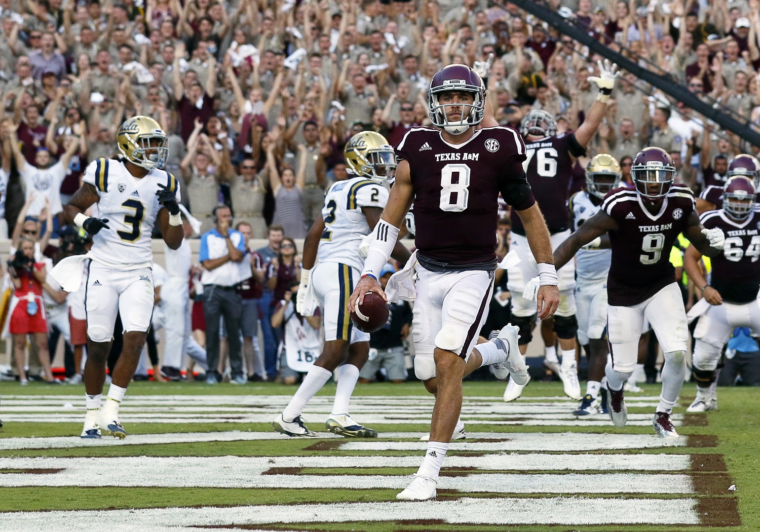 Sep 3, 2016; College Station, TX, USA; Texas A&M Aggies quarterback Trevor Knight (8) goes in for the one-yard touchdown run in overtime against the UCLA Bruins. Texas A&M won 31-24. Mandatory Credit: Ray Carlin-USA TODAY Sports