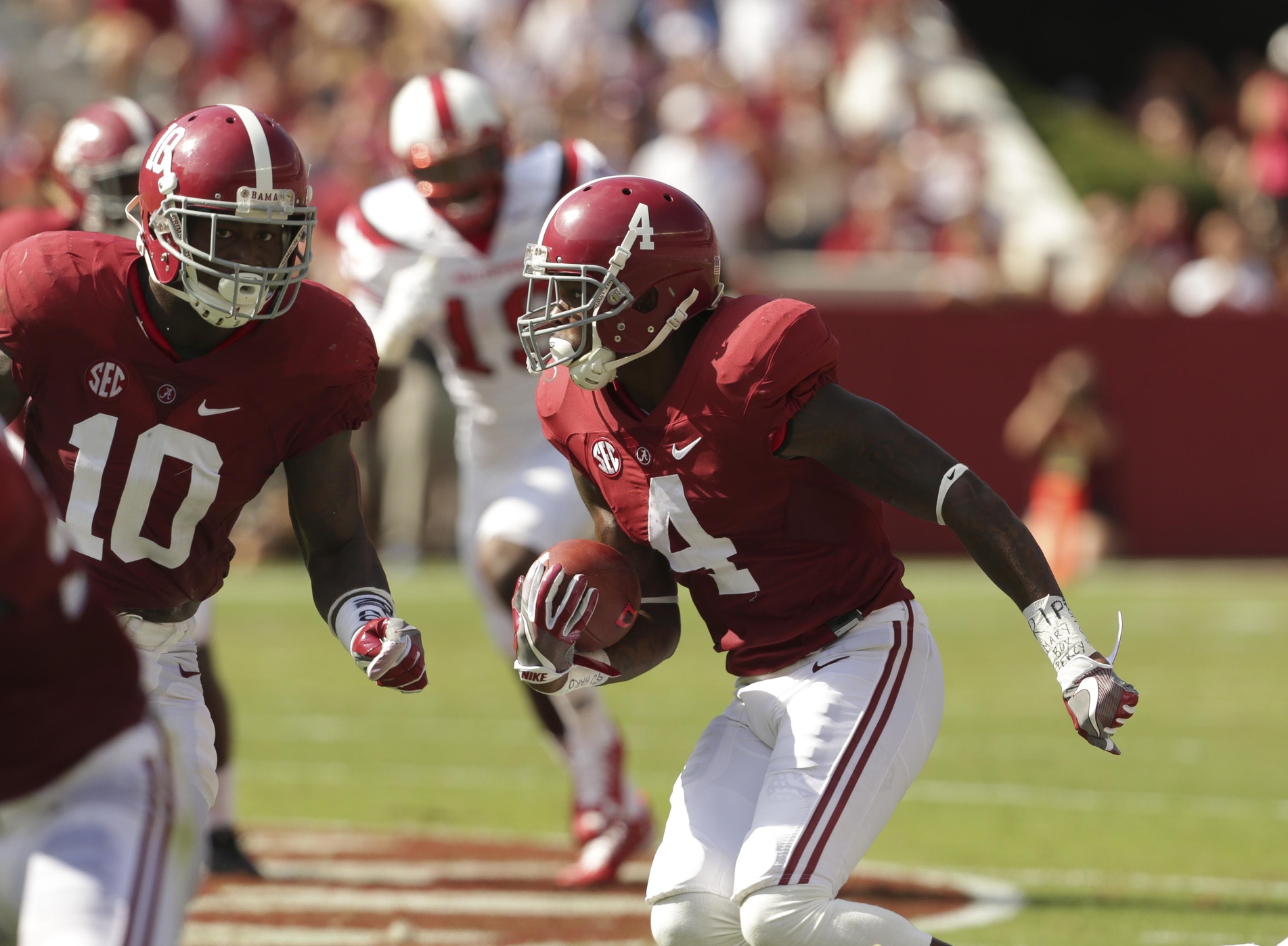 Sep 10, 2016; Tuscaloosa, AL, USA; Alabama Crimson Tide defensive back Eddie Jackson (4) returns an interception for a touchdown against Western Kentucky Hilltoppers Hilltoppers at Bryant-Denny Stadium. Mandatory Credit: Marvin Gentry-USA TODAY Sports