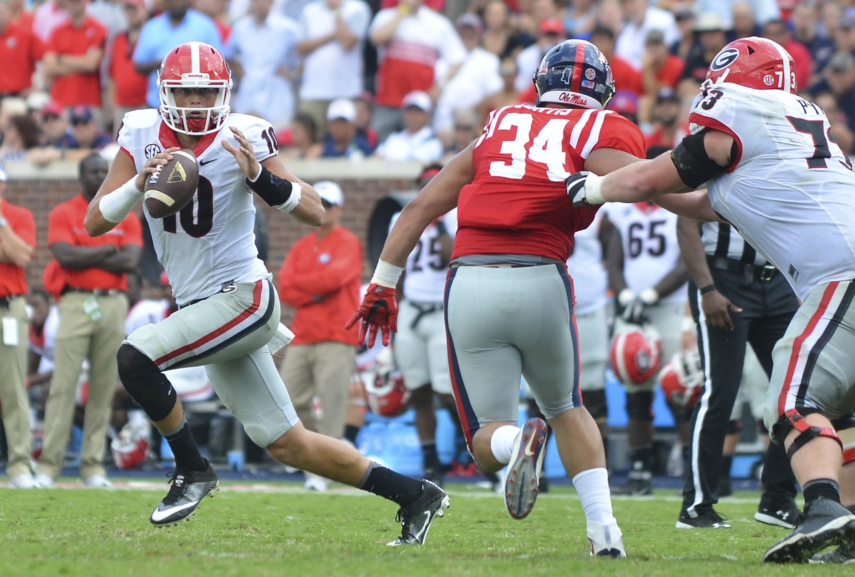 Sep 24, 2016; Oxford, MS, USA; Georgia Bulldogs quarterback Jacob Eason (10) scrambles during the fourth quarter of the game against the Mississippi Rebels at Vaught-Hemingway Stadium. Mississippi won 45-14. Mandatory Credit: Matt Bush-USA TODAY Sports