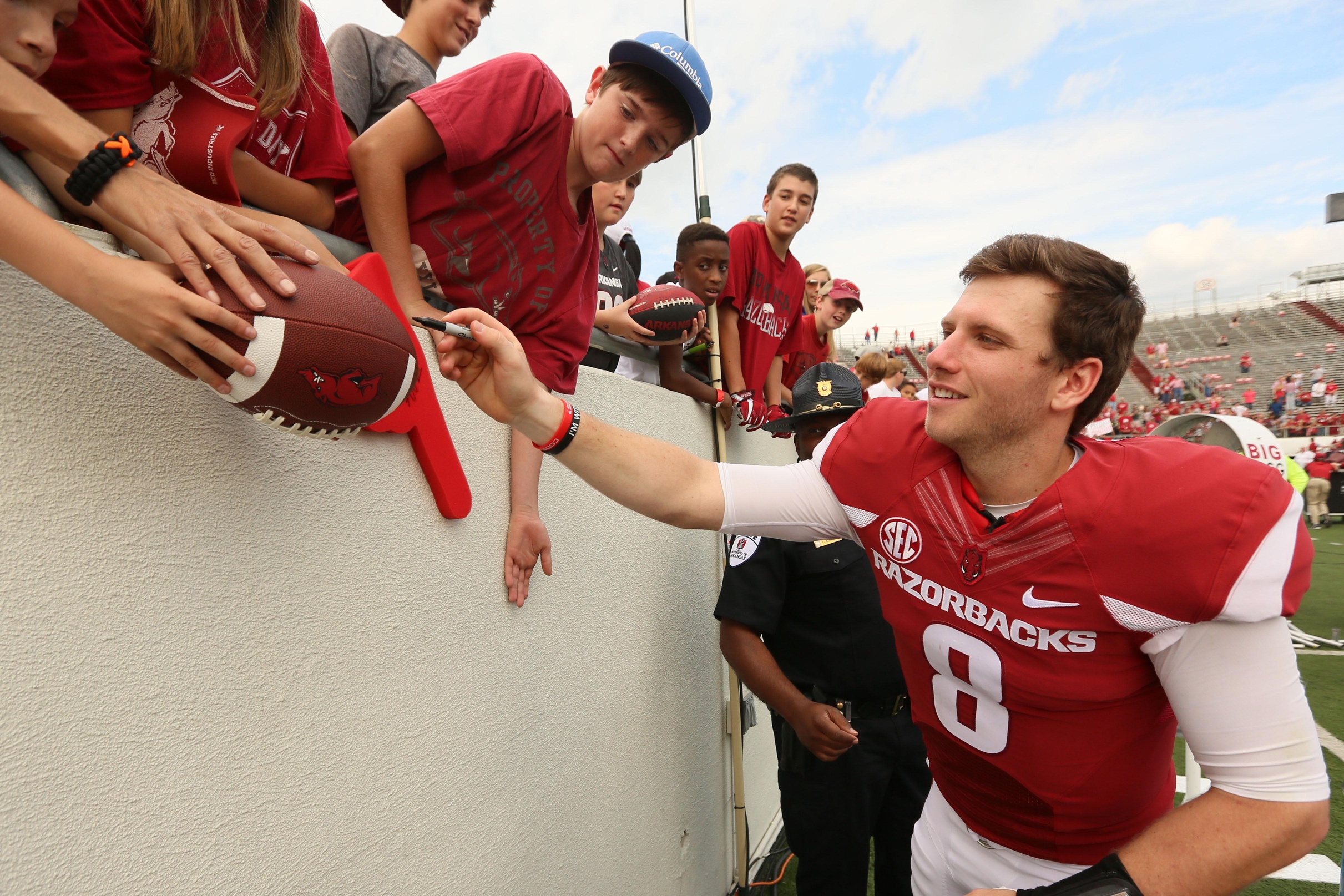 Oct 1, 2016; Little Rock, AR, USA; Arkansas Razorbacks quarterback Austin Allen (8) signs autographs for fans following the game against the Alcorn State Braves at War Memorial Stadium. Arkansas defeated Alcorn State 52-10. Mandatory Credit: Nelson Chenault-USA TODAY Sports