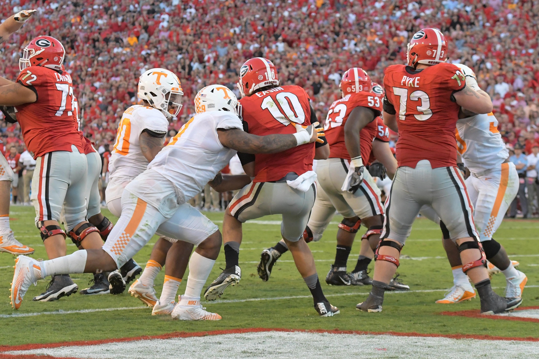 Oct 1, 2016; Athens, GA, USA; Tennessee Volunteers defensive end Derek Barnett (9) hits Georgia Bulldogs quarterback Jacob Eason (10) causing a fumble recovered by Tennessee for a touchdown during the fourth quarter at Sanford Stadium. Tennessee defeated Georgia 34-31. Mandatory Credit: Dale Zanine-USA TODAY Sports