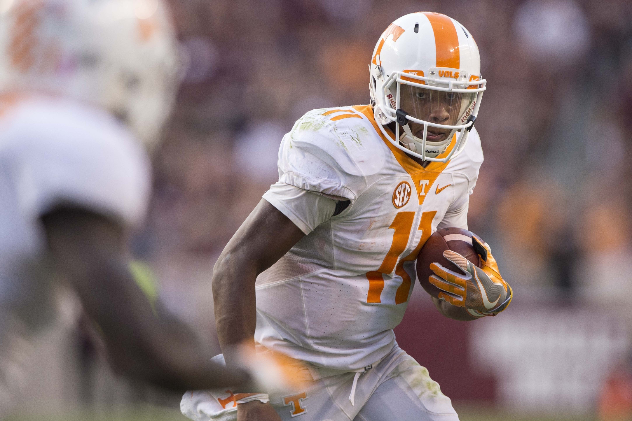 Oct 8, 2016; College Station, TX, USA; Tennessee Volunteers quarterback Joshua Dobbs (11) runs with the ball against the Texas A&M Aggies during the second half at Kyle Field. The Aggies defeat the Volunteers 45-38 in overtime. Mandatory Credit: Jerome Miron-USA TODAY Sports