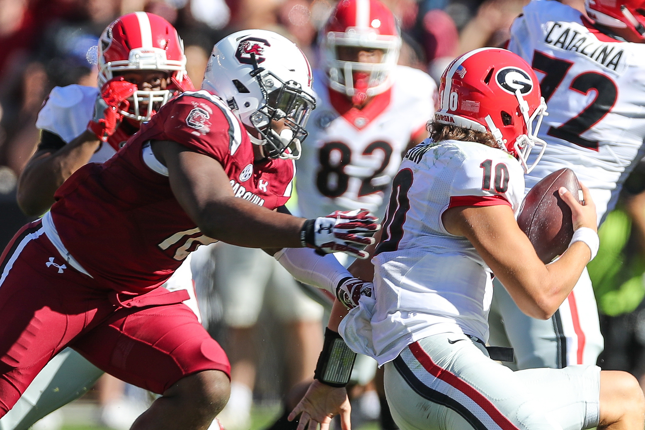 Oct 9, 2016; Columbia, SC, USA; South Carolina Gamecocks linebacker T.J. Holloman (11) gets a handful of the jersey of Georgia Bulldogs quarterback Jacob Eason (10) during the second quarter at Williams-Brice Stadium. Mandatory Credit: Jim Dedmon-USA TODAY Sports