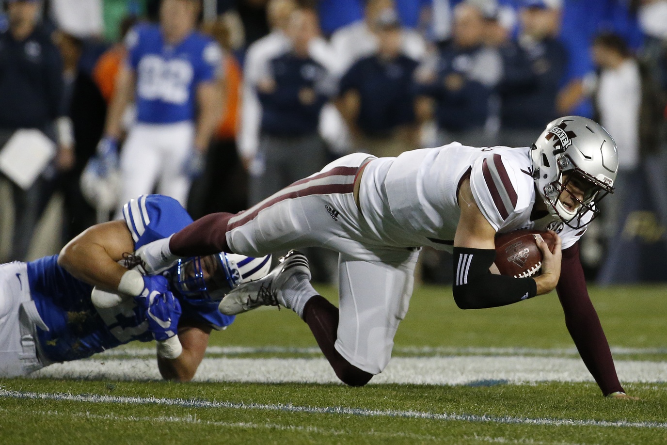 Oct 14, 2016; Provo, UT, USA; Mississippi State Bulldogs quarterback Nick Fitzgerald (7) is tackled for a loss by Brigham Young Cougars linebacker Adam Pulsipher (41) in the first quarter at Lavell Edwards Stadium. Mandatory Credit: Jeff Swinger-USA TODAY Sports