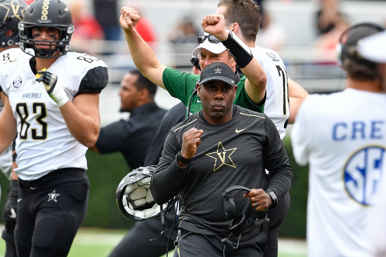 Oct 15, 2016; Athens, GA, USA; Vanderbilt Commodores head coach Derek Mason pumps his fist reacting to a defensive stop against the Georgia Bulldogs at the end of the fourth quarter at Sanford Stadium. Vanderbilt defeated Georgia 17-16. Mandatory Credit: Dale Zanine-USA TODAY Sports