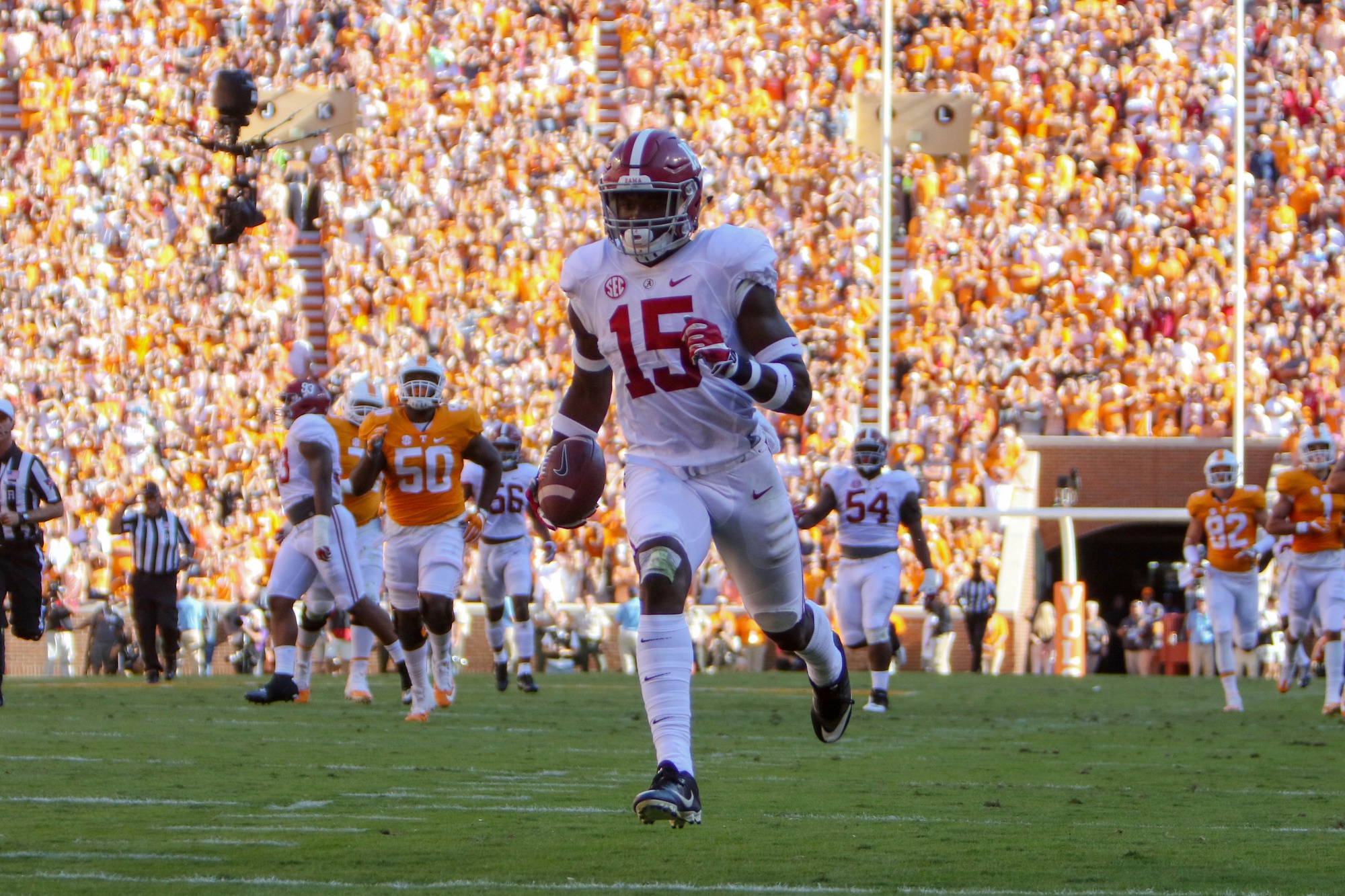 Oct 15, 2016; Knoxville, TN, USA; Alabama Crimson Tide defensive back Ronnie Harrison (15) returns an interception for a touchdown against the Tennessee Volunteers during the first half at Neyland Stadium. Mandatory Credit: Randy Sartin-USA TODAY Sports