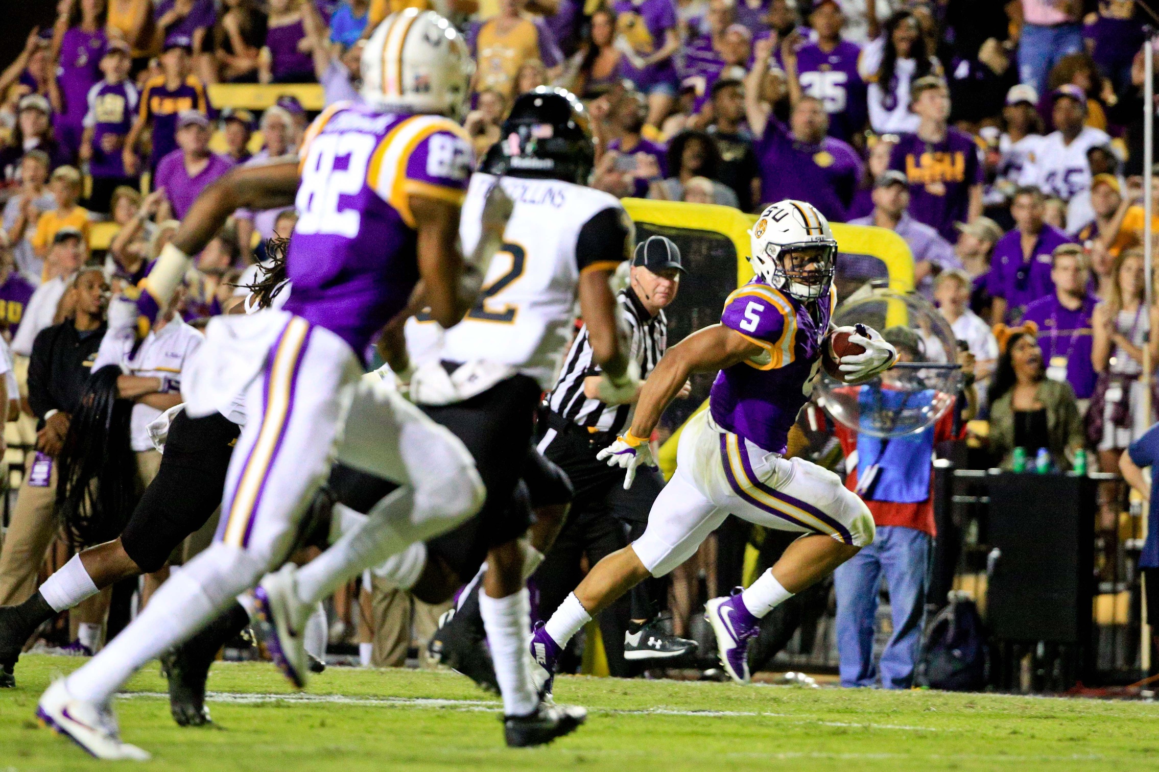 Oct 15, 2016; Baton Rouge, LA, USA; LSU Tigers running back Derrius Guice (5) runs for a touchdown against the Southern Miss Golden Eagles during the third quarter of a game at Tiger Stadium. Mandatory Credit: Derick E. Hingle-USA TODAY Sports