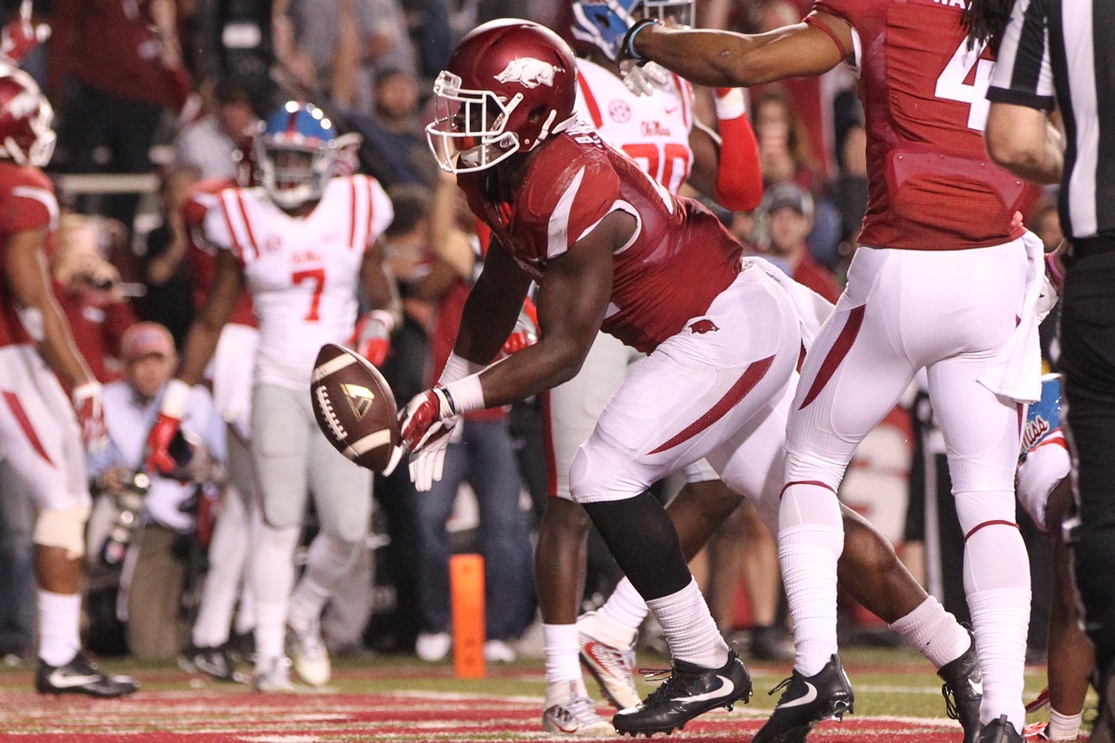 Oct 15, 2016; Fayetteville, AR, USA; Arkansas Razorbacks running back Rawleigh  Williams  III (22) scores a touchdown in the third quarter against the Ole Miss Rebels at Donald W. Reynolds Razorback Stadium. Arkansas defeated Ole Miss 34-30. Mandatory Credit: Nelson Chenault-USA TODAY Sports