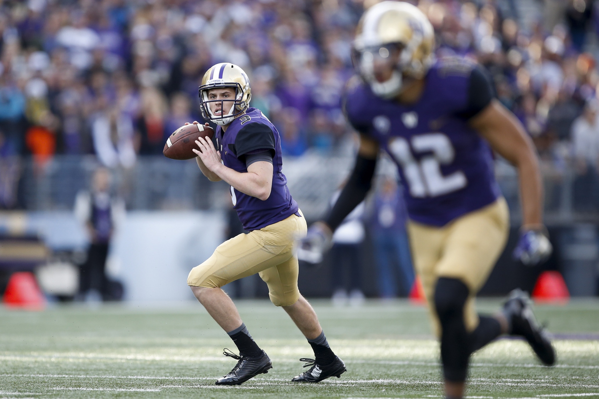 Oct 22, 2016; Seattle, WA, USA; Washington Huskies quarterback Jake Browning (3) eyes wide receiver Aaron Fuller (12) for a touchdown against the Oregon State Beavers during the first quarter at Husky Stadium. Mandatory Credit: Jennifer Buchanan-USA TODAY Sports