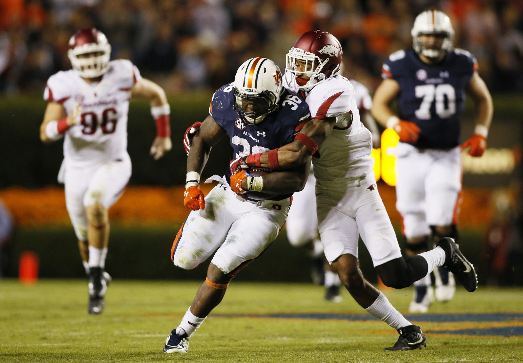 Oct 22, 2016; Auburn, AL, USA; Arkansas Razorbacks defensive back Santos Ramirez (9) tackles Auburn Tigers running back Kamryn Pettway (36) during the third quarter at Jordan Hare Stadium. The Tigers beat the Razorbacks 56-3. Mandatory Credit: John Reed-USA TODAY Sports