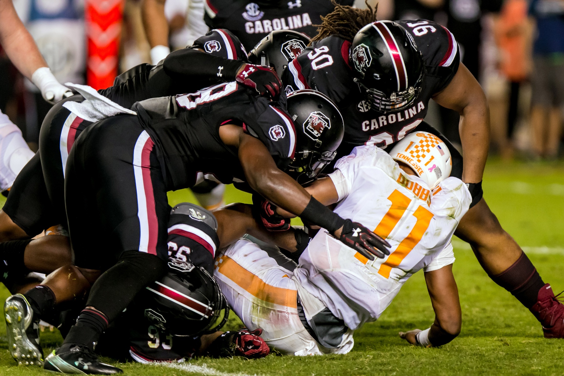 Oct 29, 2016; Columbia, SC, USA; South Carolina Gamecocks linebacker Jonathan Walton (28) and South Carolina Gamecocks defensive lineman Taylor Stallworth (90) stop Tennessee Volunteers quarterback Joshua Dobbs (11) in the first quarter at Williams-Brice Stadium. Mandatory Credit: Jeff Blake-USA TODAY Sports