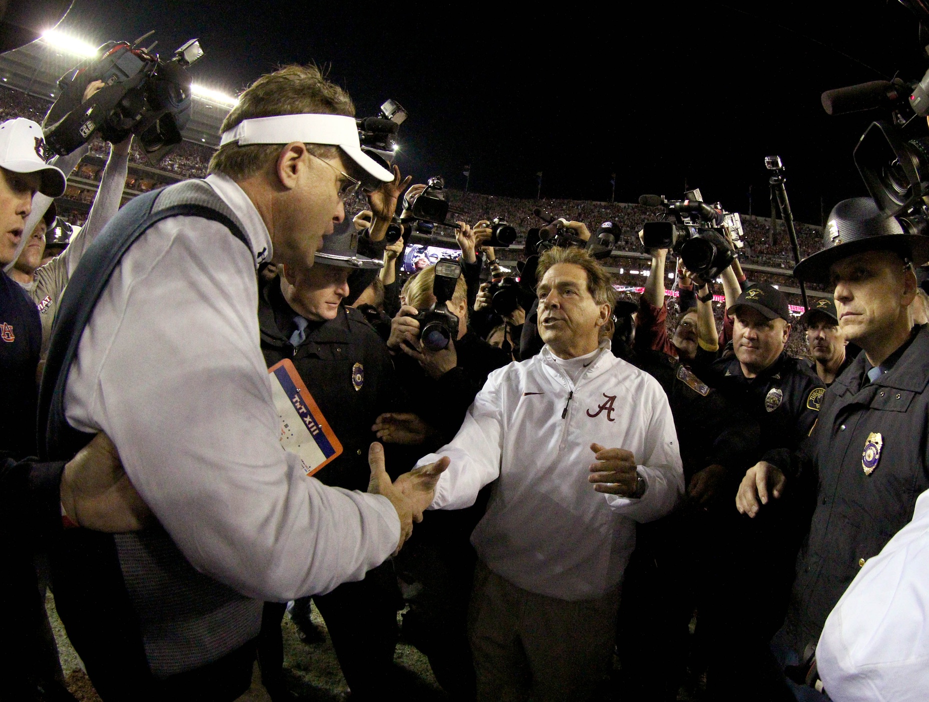 Nov 29, 2014; Tuscaloosa, AL, USA; Alabama Crimson Tide head coach Nick Saban shakes hands with Auburn Tigers head coach Gus Malzahn (left) after defeating the Tigers 55-44 at Bryant-Denny Stadium. Mandatory Credit: Marvin Gentry-USA TODAY Sports