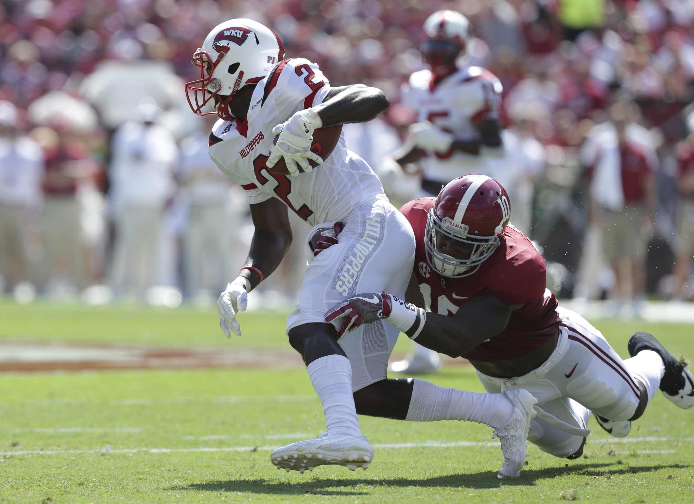 Sep 10, 2016; Tuscaloosa, AL, USA; Western Kentucky Hilltoppers wide receiver Taywan Taylor (2) is tackled by Alabama Crimson Tide linebacker Reuben Foster (10) at Bryant-Denny Stadium. Mandatory Credit: Marvin Gentry-USA TODAY Sports