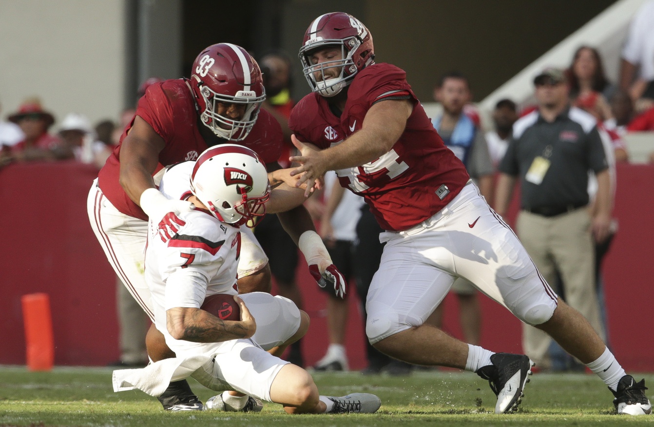 Sep 10, 2016; Tuscaloosa, AL, USA; Western Kentucky Hilltoppers quarterback Tyler Ferguson (7) tries to get away from Alabama Crimson Tide defensive lineman Dakota Ball (44) and defensive lineman Jonathan Allen (93) at Bryant-Denny Stadium. The Tide defeated the Hilltoppers 38-10. Mandatory Credit: Marvin Gentry-USA TODAY Sports