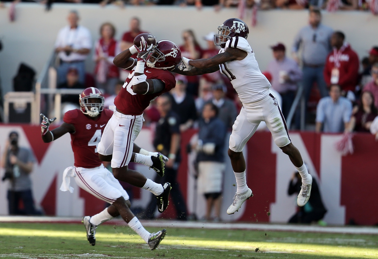 Oct 22, 2016; Tuscaloosa, AL, USA; Alabama Crimson Tide defensive back Marlon Humphrey (26) intercepts the ball from Texas A&M Aggies wide receiver Josh Reynolds (11) at Bryant-Denny Stadium. Mandatory Credit: Marvin Gentry-USA TODAY Sports