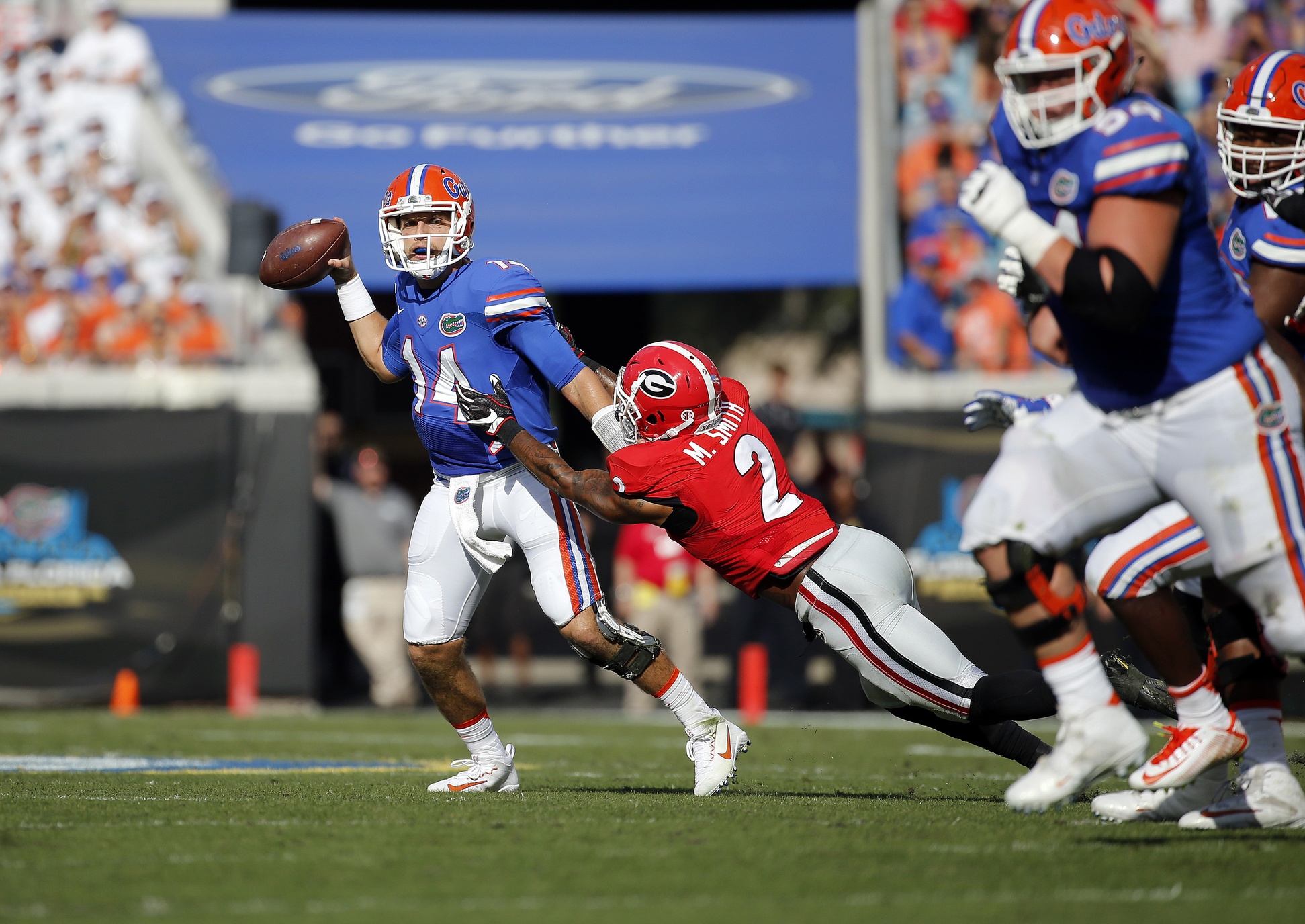 Oct 29, 2016; Jacksonville, FL, USA; Georgia Bulldogs defensive back Maurice Smith (2) sacks Florida Gators quarterback Luke Del Rio (14) during the first quarter at EverBank Field. Mandatory Credit: Kim Klement-USA TODAY Sports