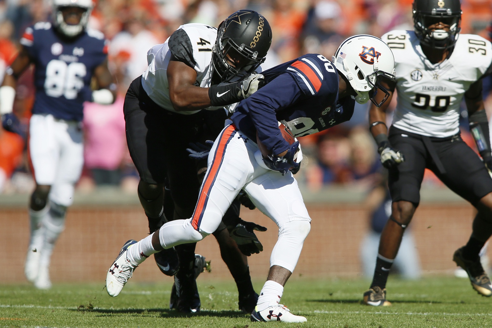 Nov 5, 2016; Auburn, AL, USA; Auburn Tigers receiver Marcus Davis (80) is tackled by by Vanderbilt Commodores linebacker Zach Cunningham (41) during the first quarter at Jordan Hare Stadium. Mandatory Credit: John Reed-USA TODAY Sports