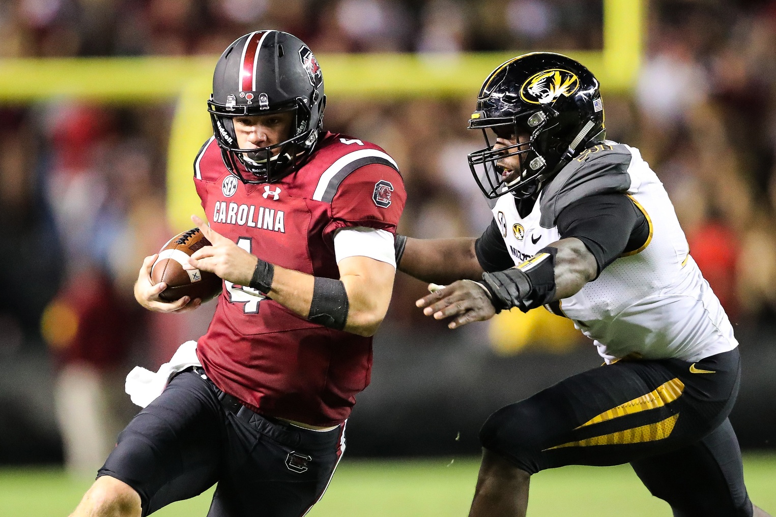 Nov 5, 2016; Columbia, SC, USA; South Carolina Gamecocks quarterback Jake Bentley (4) tries to outrun Missouri Tigers defensive end Charles Harris (91) during the second half at Williams-Brice Stadium. South Carolina wins 31-21 over Missouri. Mandatory Credit: Jim Dedmon-USA TODAY Sports