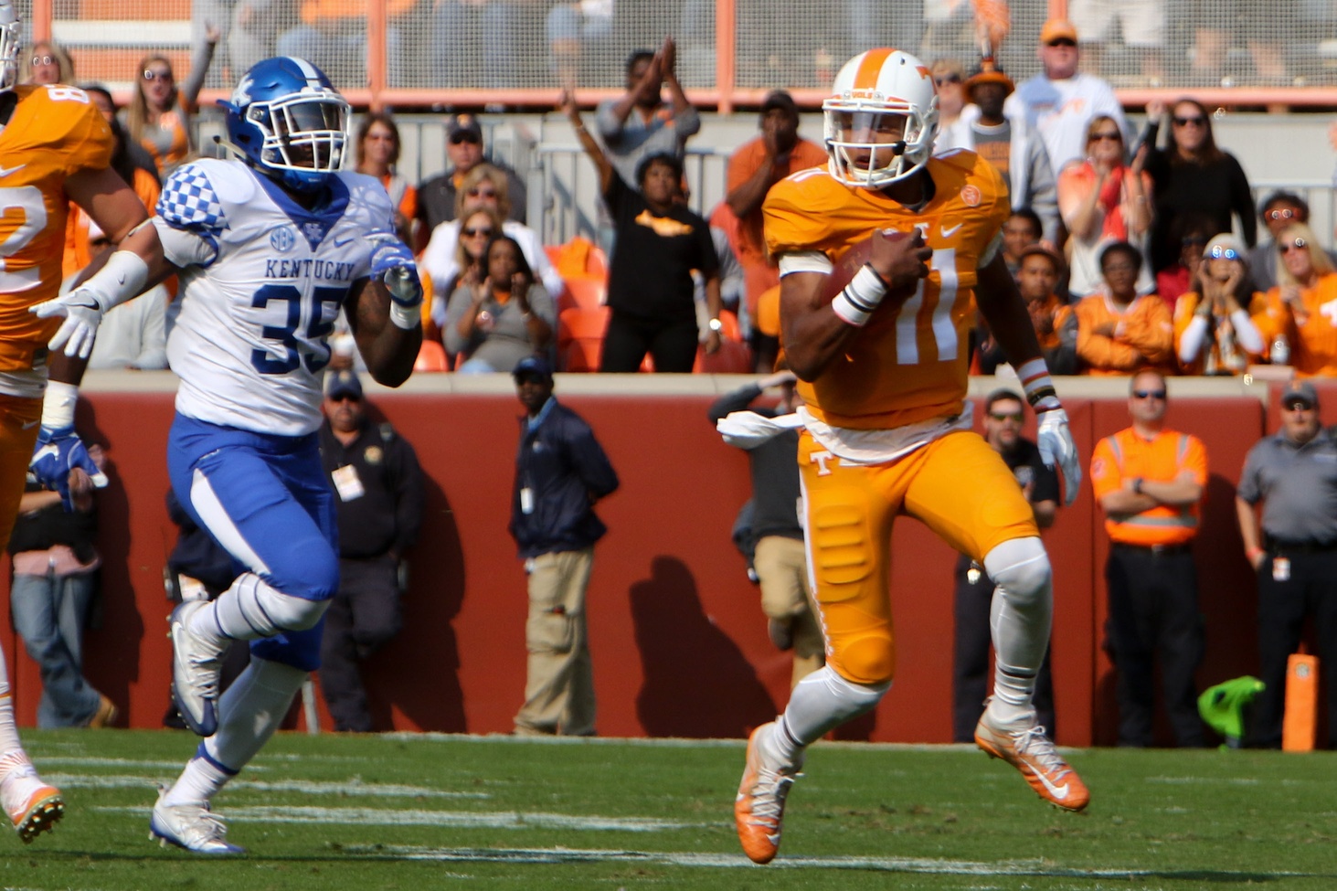 Nov 12, 2016; Knoxville, TN, USA; Tennessee Volunteers quarterback Joshua Dobbs (11) runs the ball against the Kentucky Wildcats during the first half at Neyland Stadium. Mandatory Credit: Randy Sartin-USA TODAY Sports