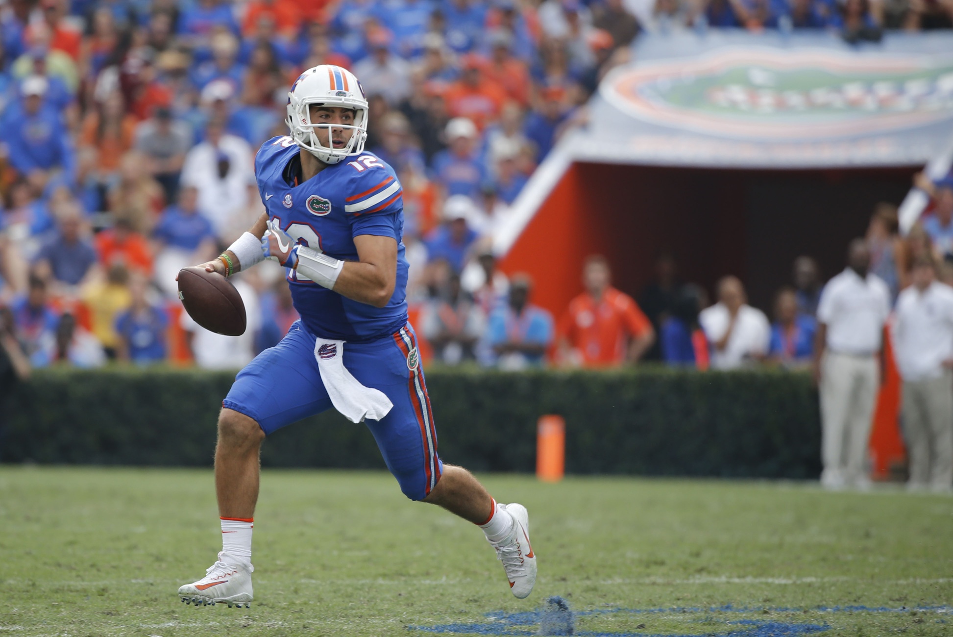 Nov 12, 2016; Gainesville, FL, USA; Florida Gators quarterback Austin Appleby (12) runs out of the pocket against the South Carolina Gamecocks during the second half at Ben Hill Griffin Stadium. Florida Gators defeated the South Carolina Gamecocks 20-7. Mandatory Credit: Kim Klement-USA TODAY Sports