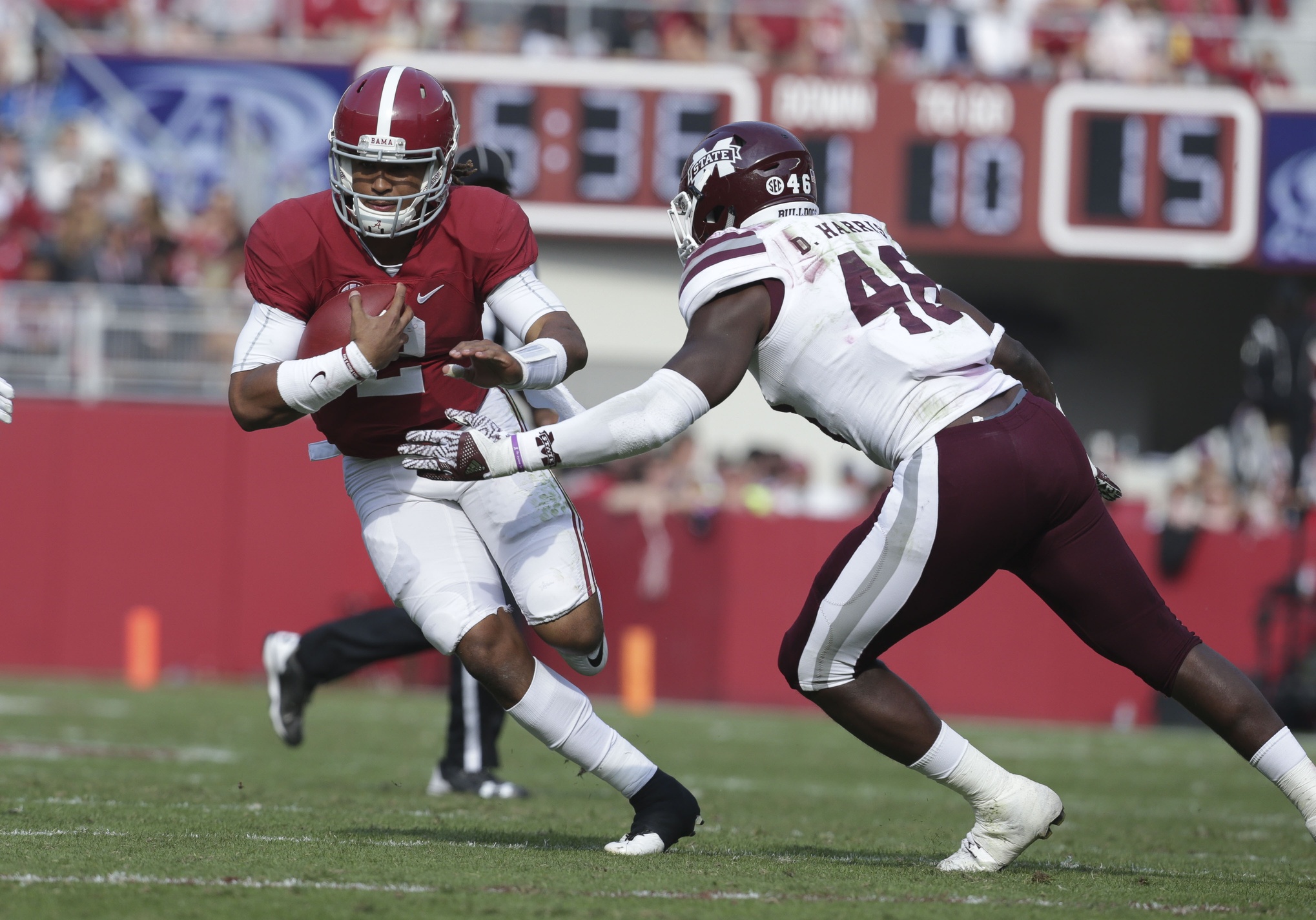 Nov 12, 2016; Tuscaloosa, AL, USA; Mississippi State Bulldogs defensive end Chris Redmon (48) reaches out for Alabama Crimson Tide quarterback Jalen Hurts (2) at Bryant-Denny Stadium. The Tide defeated the Bulldogs 51-3. Mandatory Credit: Marvin Gentry-USA TODAY Sports