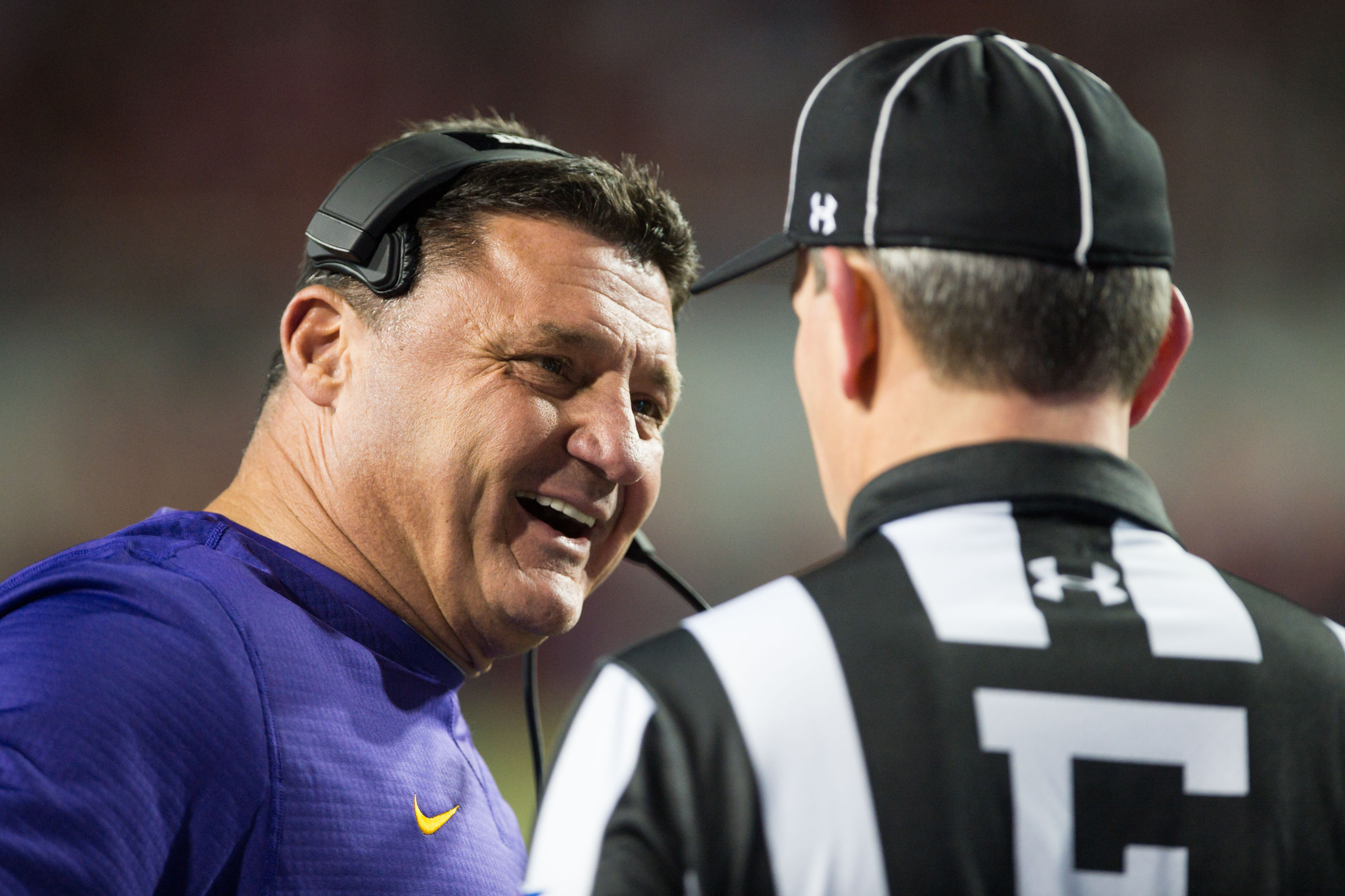 Nov 12, 2016; Fayetteville, AR, USA; LSU Tigers head coach Ed Orgeron talks to an official during a review of a play during the second quarter of the game against the Arkansas Razorbacks at Donald W. Reynolds Razorback Stadium. Mandatory Credit: Brett Rojo-USA TODAY Sports