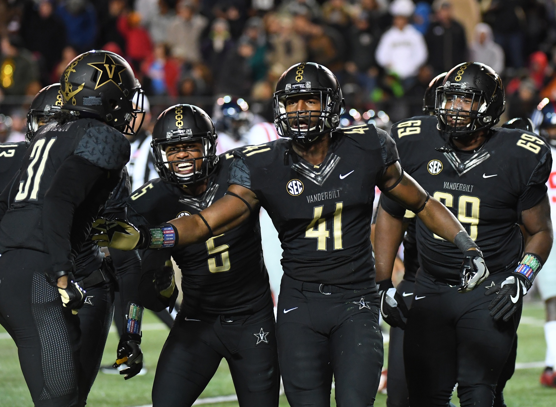 Nov 19, 2016; Nashville, TN, USA; Vanderbilt Commodores inside linebacker Zach Cunningham (41) is congratulated by teammates after a fumble recovery during the second half against the Mississippi Rebels at Vanderbilt Stadium. Vanderbilt won 38-17. Mandatory Credit: Christopher Hanewinckel-USA TODAY Sports