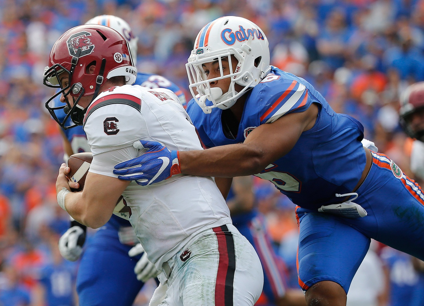 Nov 12, 2016; Gainesville, FL, USA; Florida Gators defensive back Quincy Wilson (6) tackles South Carolina Gamecocks quarterback Jake Bentley (4) during the second half at Ben Hill Griffin Stadium. Florida Gators defeated the South Carolina Gamecocks 20-7. Mandatory Credit: Kim Klement-USA TODAY Sports