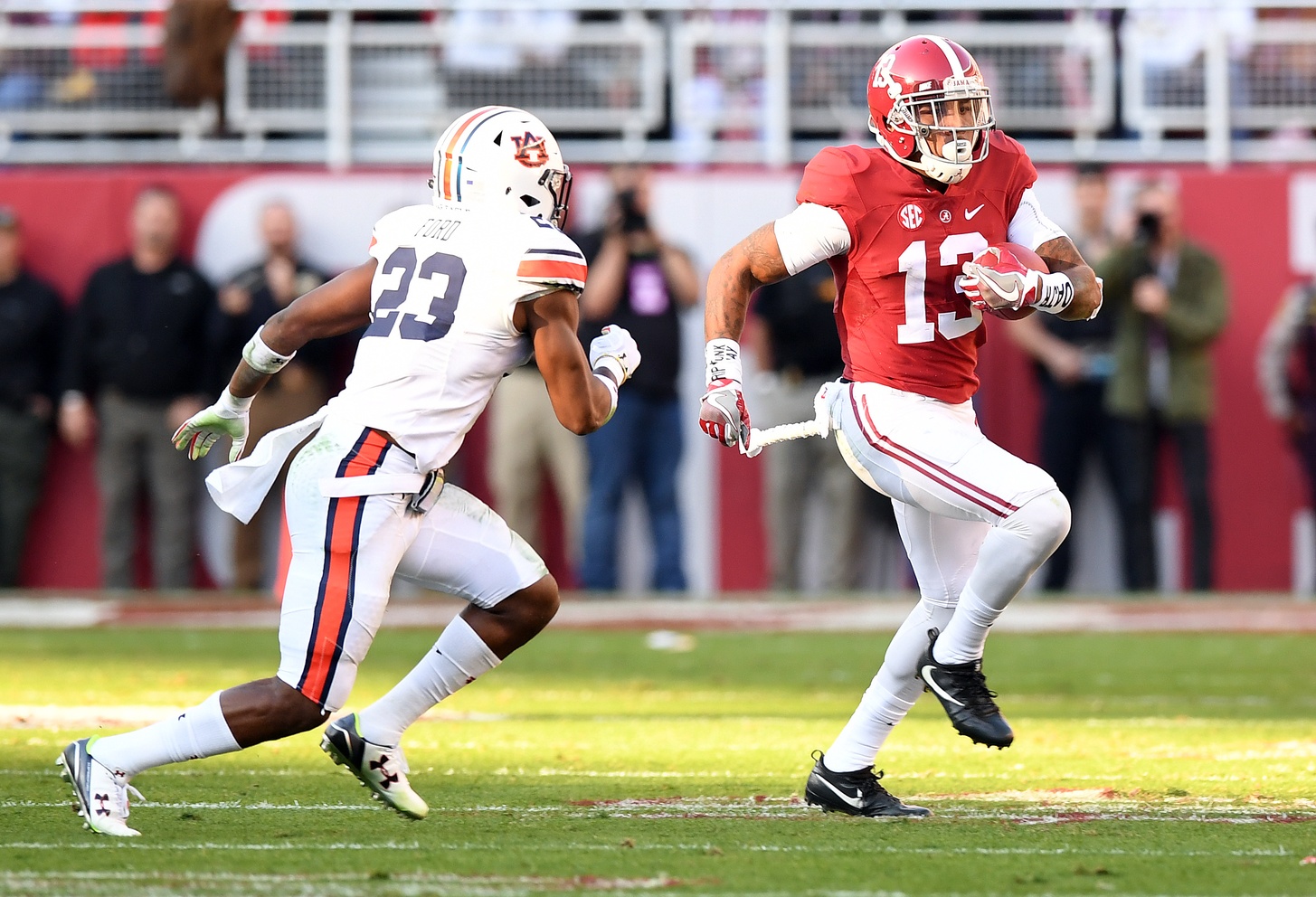 Nov 26, 2016; Tuscaloosa, AL, USA; Alabama Crimson Tide wide receiver ArDarius Stewart (13) carries Auburn Tigers defensive back Johnathan Ford (23) during the first quarter at Bryant-Denny Stadium. Mandatory Credit: John David Mercer-USA TODAY Sports