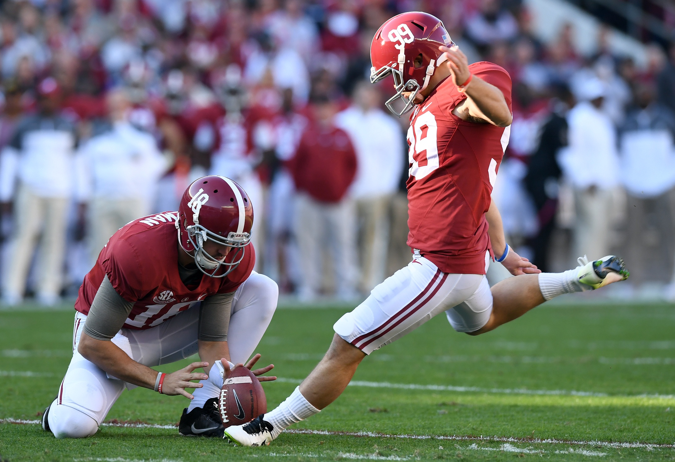 Nov 26, 2016; Tuscaloosa, AL, USA; Alabama Crimson Tide place kicker Adam Griffith (99) kicks a field goal against the Auburn Tigers during the first quarter at Bryant-Denny Stadium. Mandatory Credit: John David Mercer-USA TODAY Sports