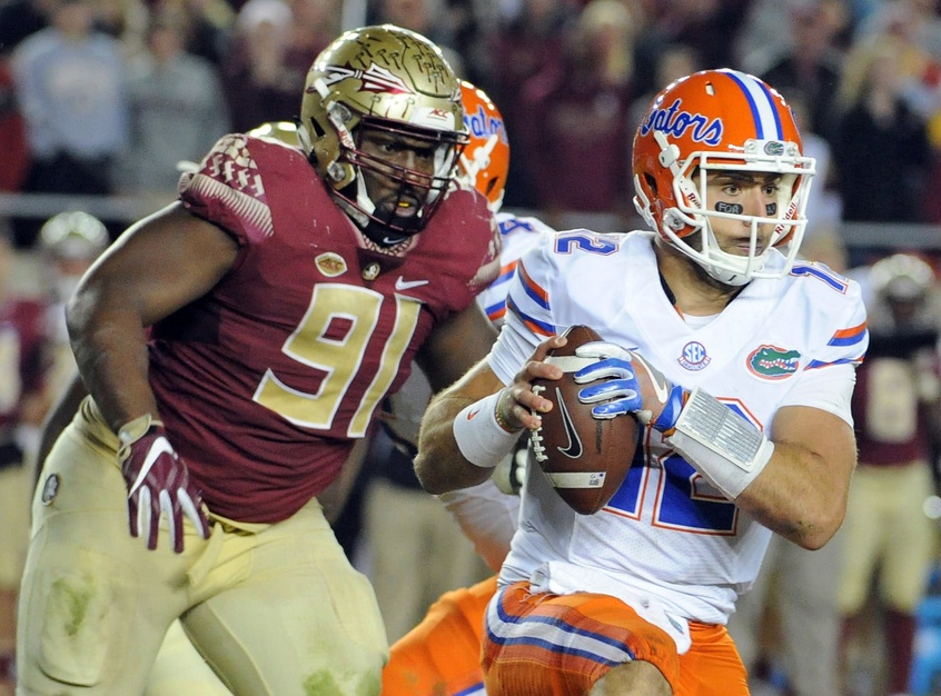 Nov 26, 2016; Tallahassee, FL, USA; Florida State Seminoles defensive tackle Derrick Nnadi (91) chases down Florida Gators quarterback Austin Appleby (12) during the second half of the game at Doak Campbell Stadium. Mandatory Credit: Melina Vastola-USA TODAY Sports