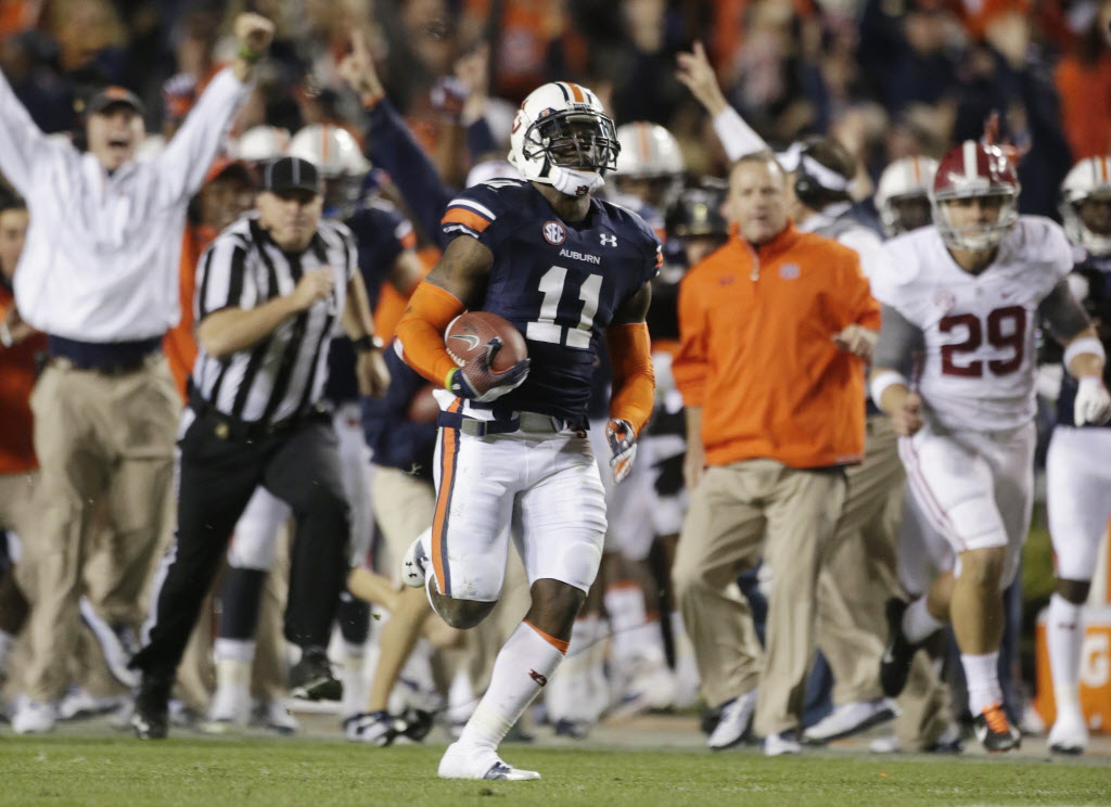 Nov 30, 2013; Auburn, AL, USA; Auburn Tigers cornerback Chris Davis (11) gets past Alabama Crimson Tide punter Cody Mandell (29) and scores a 100 yard touchdown during the fourth quarter at Jordan Hare Stadium. Auburn Tigers won 34-28. Mandatory Credit: John David Mercer-USA TODAY Sports