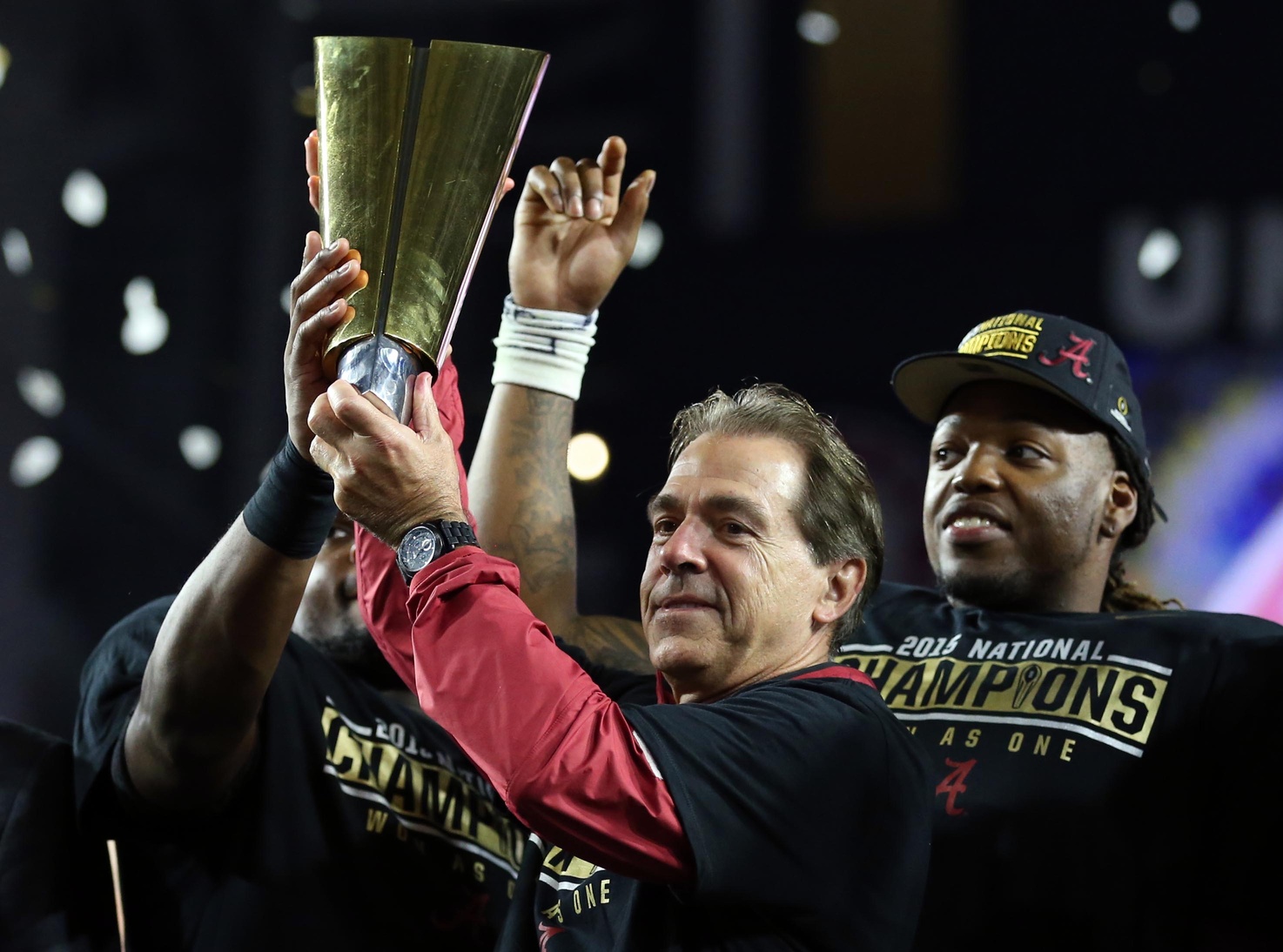 Jan 11, 2016; Glendale, AZ, USA; Alabama Crimson Tide head coach Nick Saban and running back Derrick Henry (right) hoist the national championship trophy after defeating the Clemson Tigers in the 2016 CFP National Championship at University of Phoenix Stadium. Mandatory Credit: Mark J. Rebilas-USA TODAY Sports