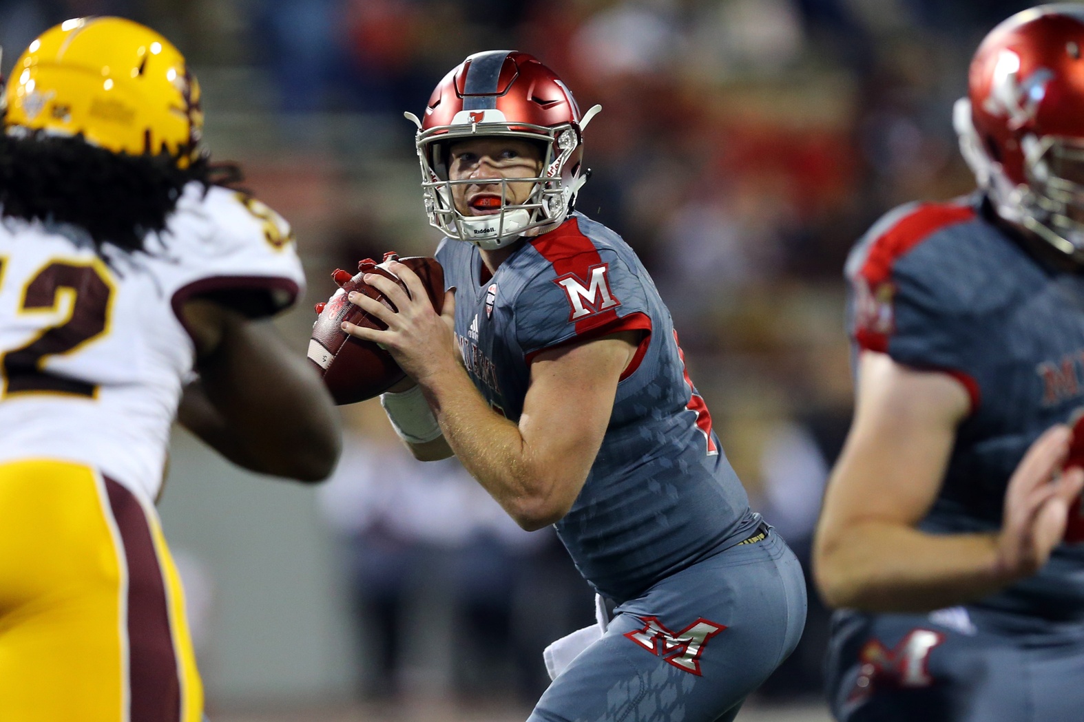 Nov 4, 2016; Oxford, OH, USA; Miami (Oh) Redhawks quarterback Gus Ragland (14) looks to pass against the Central Michigan Chippewas in the first half at Fred Yager Stadium. Mandatory Credit: Aaron Doster-USA TODAY Sports